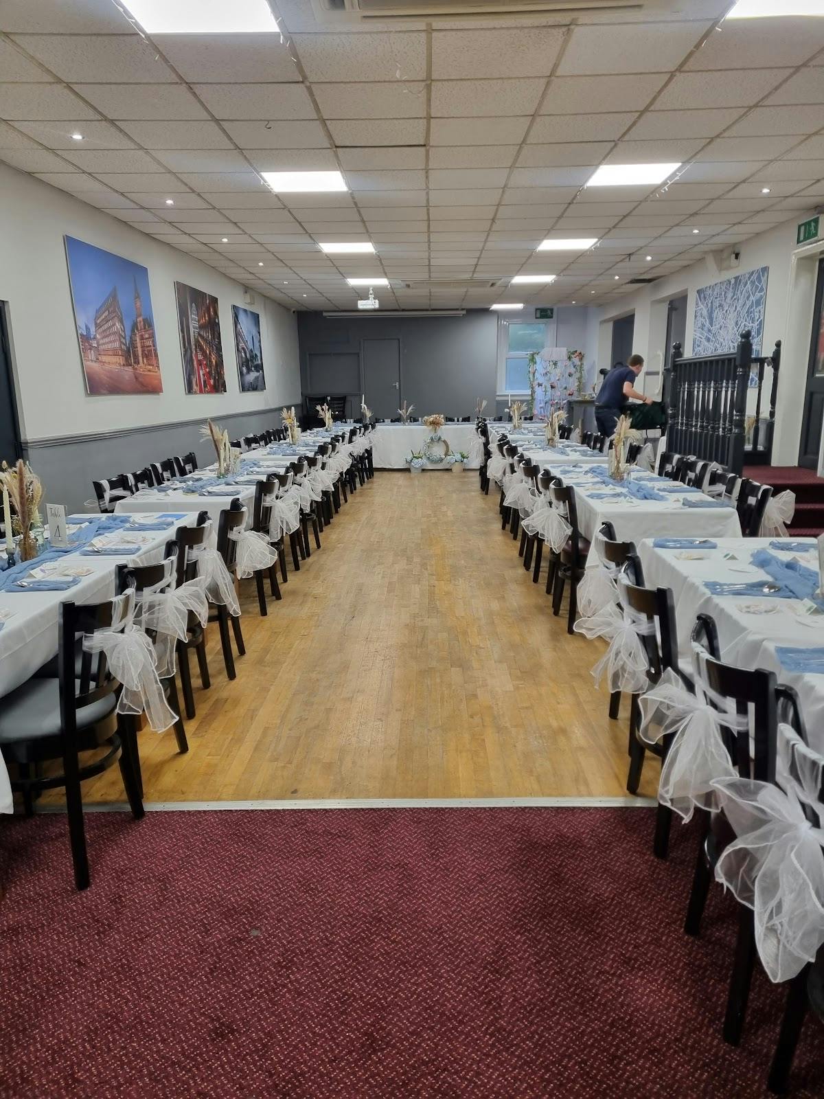 Elegant party room with blue linens, perfect for formal events and gatherings.