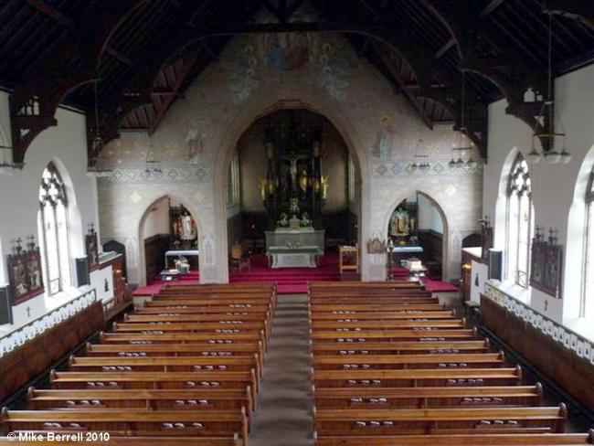 "Main Hall in St John's Parish Centre with stained glass, perfect for weddings and gatherings."
