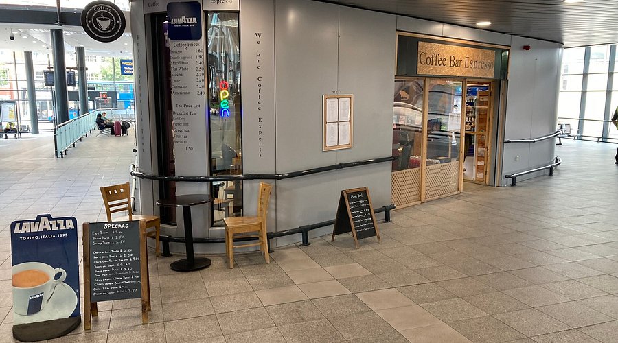 Cafe at Bus Stop Cafe: modern coffee bar with outdoor seating for events and meetings.