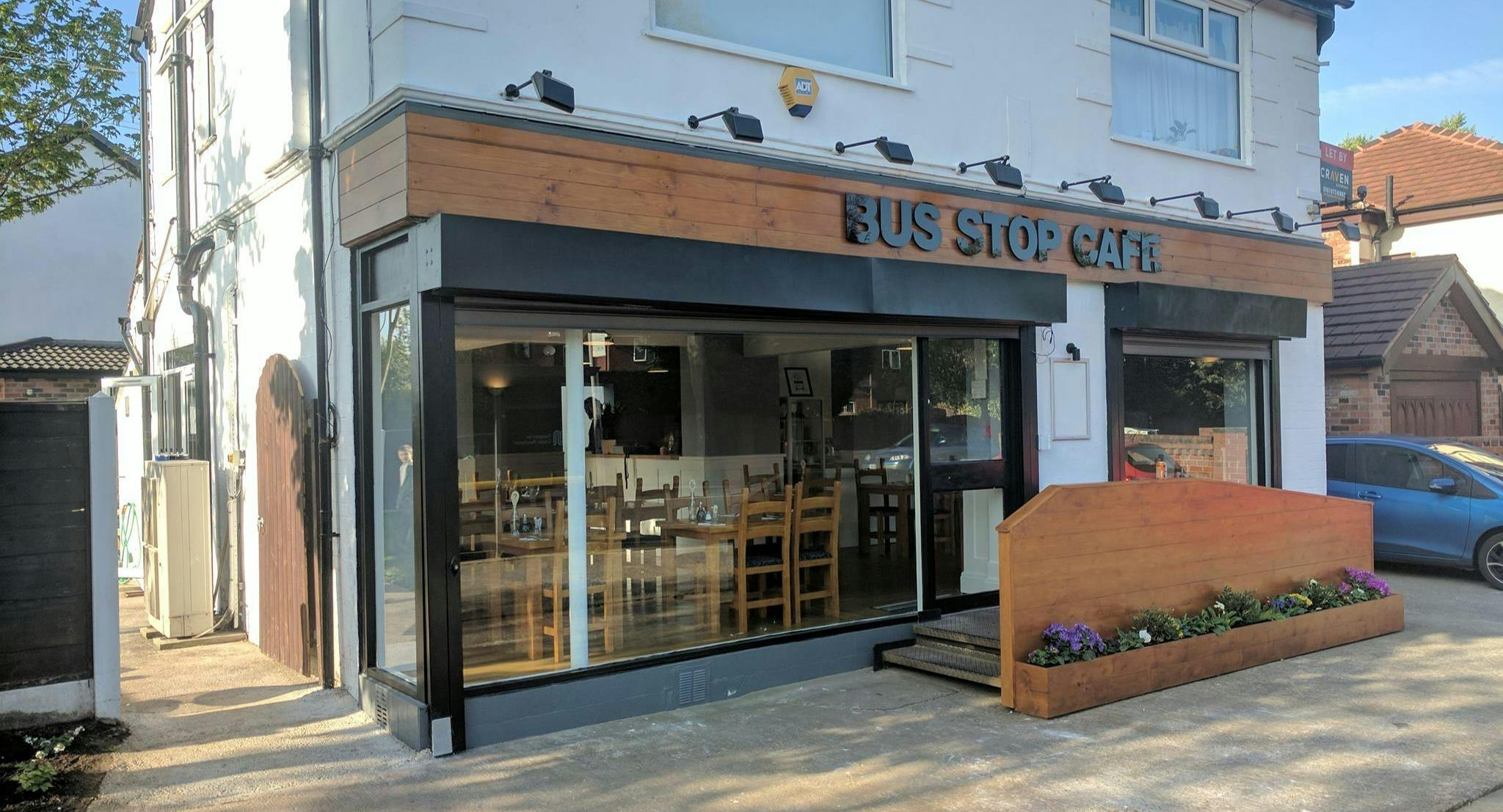 Bus Stop Café with large windows, perfect for team-building workshops and casual gatherings.