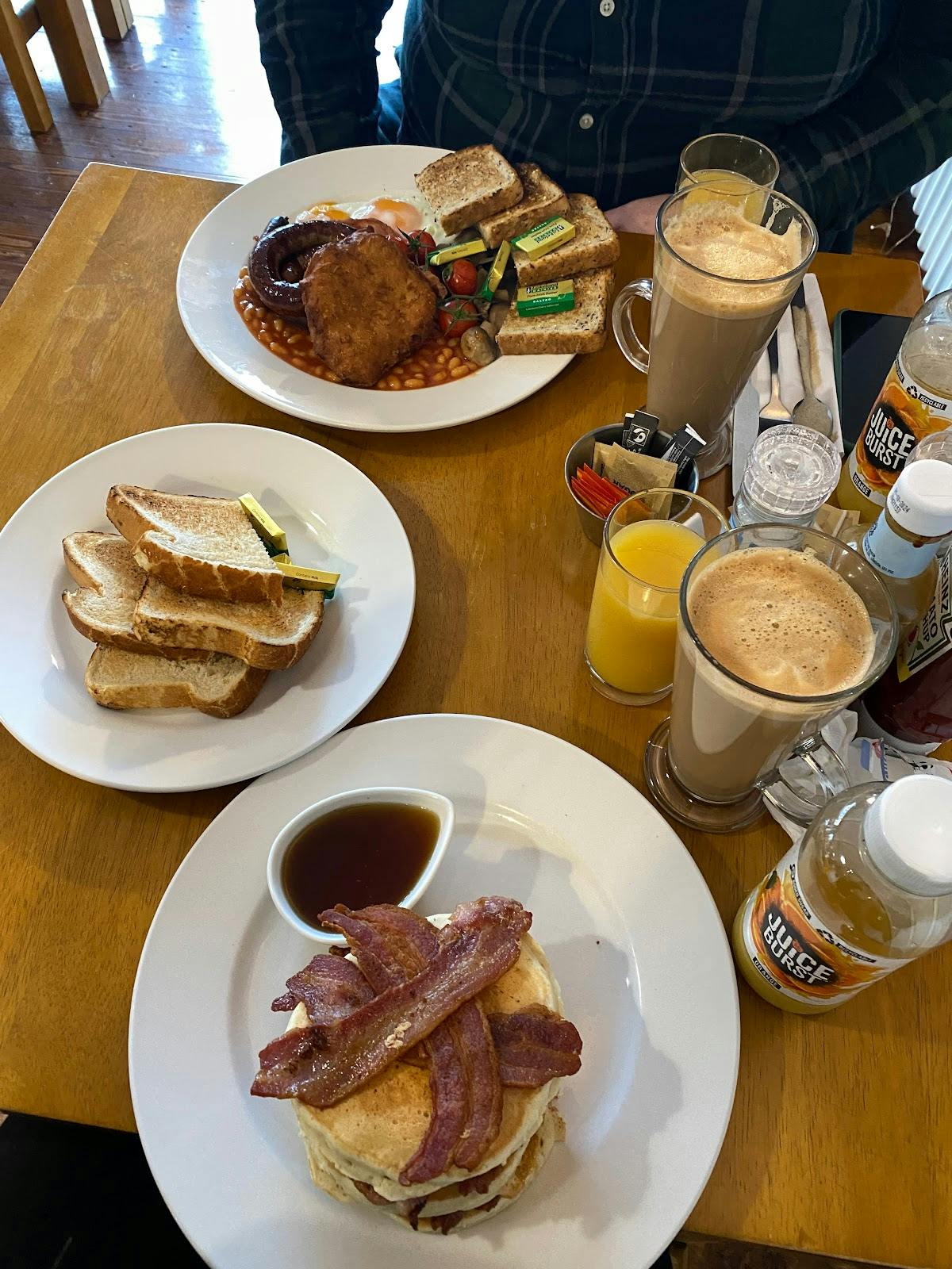 Breakfast table at Bus Stop Cafe featuring toast and coffee for morning meetings.