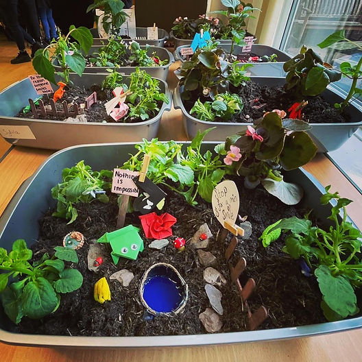 Miniature garden display at Hulme Community Hall for creative team-building events.
