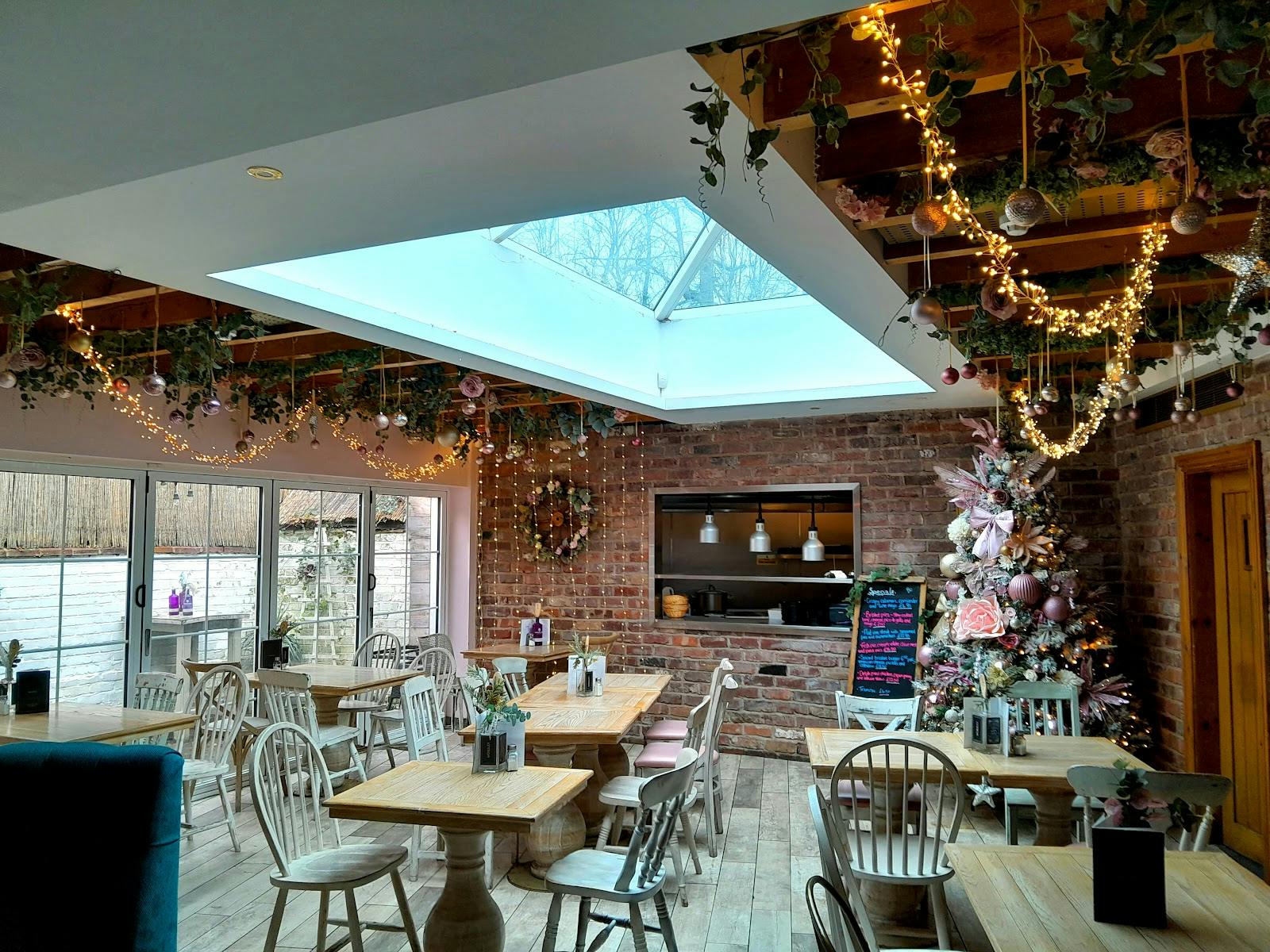 Elegant restaurant event space with rustic beams, perfect for gatherings and workshops.