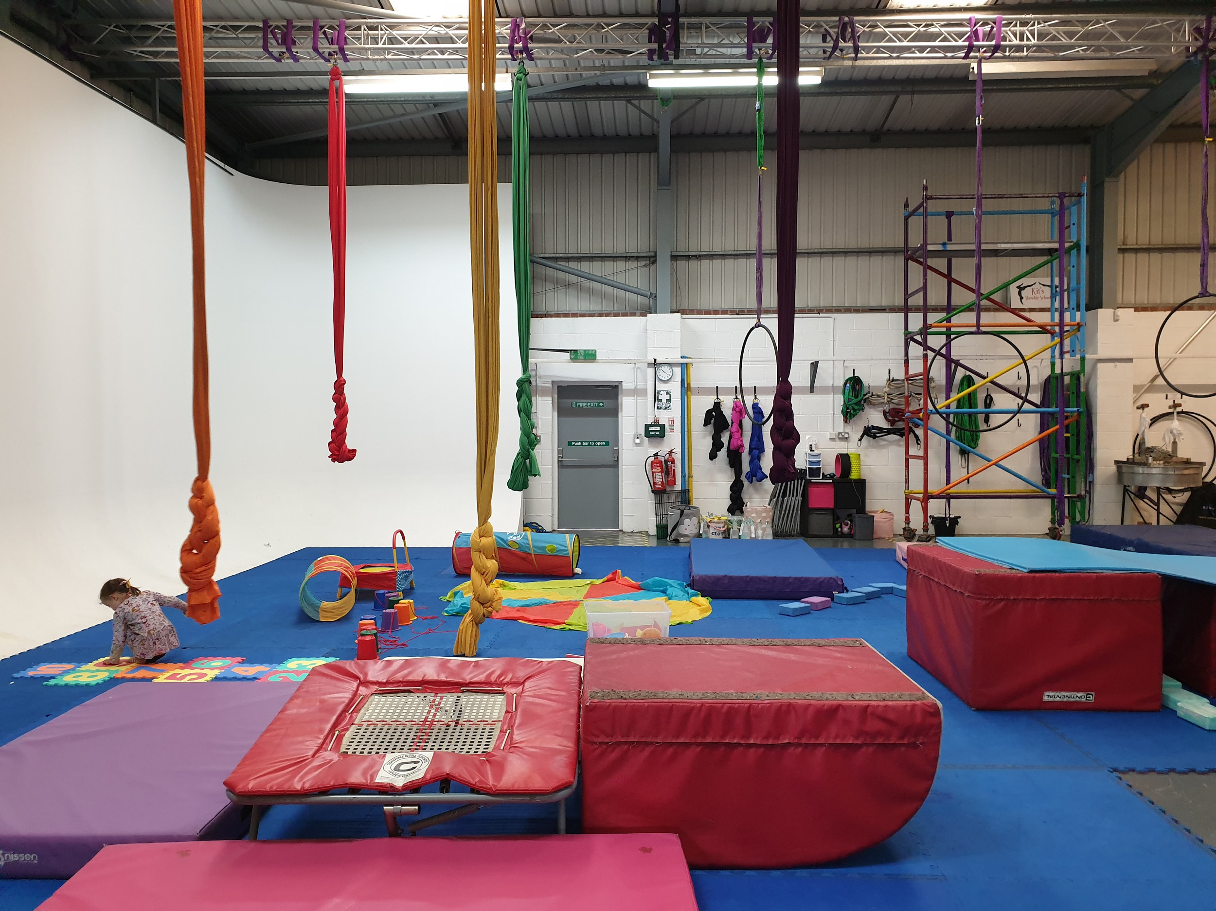 Acrobalance in Cloud Aerial Arts with colorful silks for dynamic events and fitness classes.