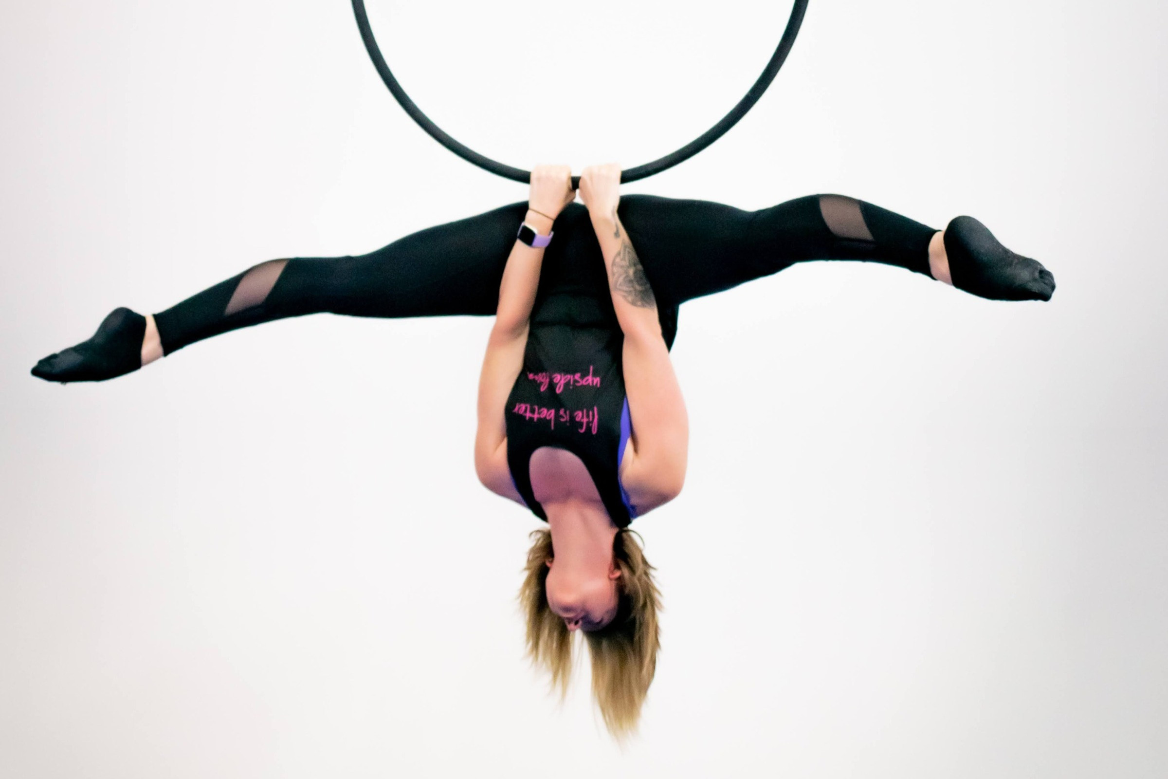 Aerial performer in hoop, enhancing engagement at dynamic events and gatherings.