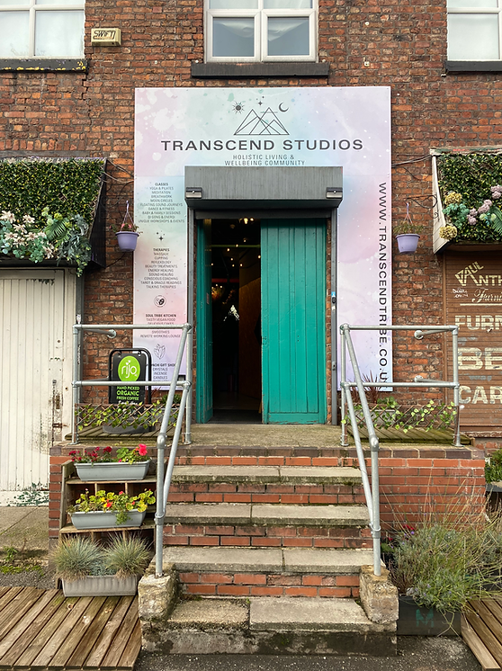 Vibrant coaching center entrance with floral decor, ideal for workshops and gatherings.