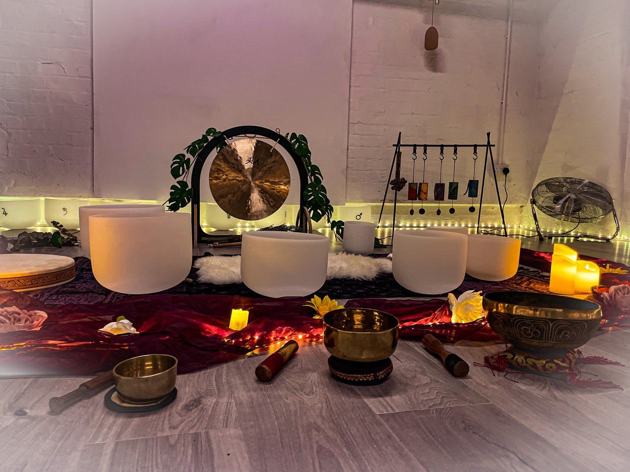 Serene Pilates studio with soft lighting, ideal for wellness retreats and sound healing.