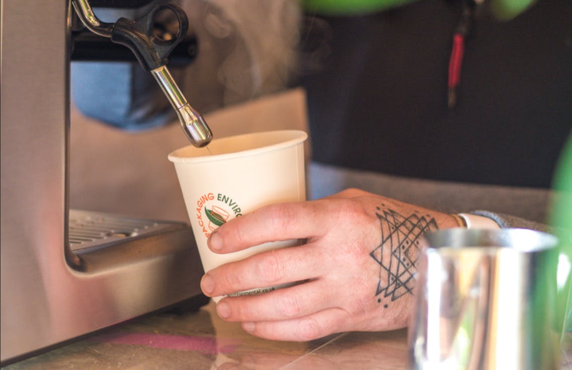 Barista brewing coffee in cozy therapy room for engaging event experiences
