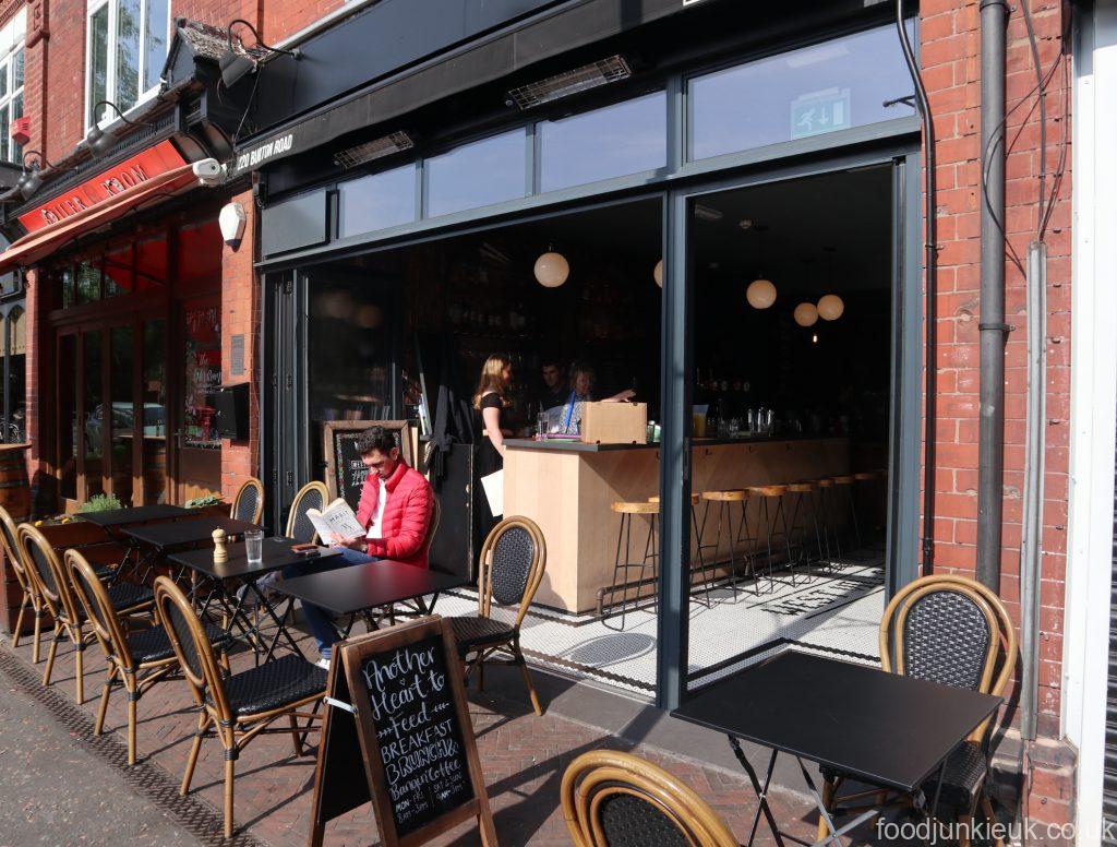 Cozy brunch cafe with outdoor seating, perfect for networking events and casual meetings.
