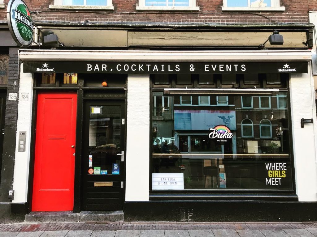 "Charming Buka Royale bar with a red door, ideal for cocktail events and gatherings."