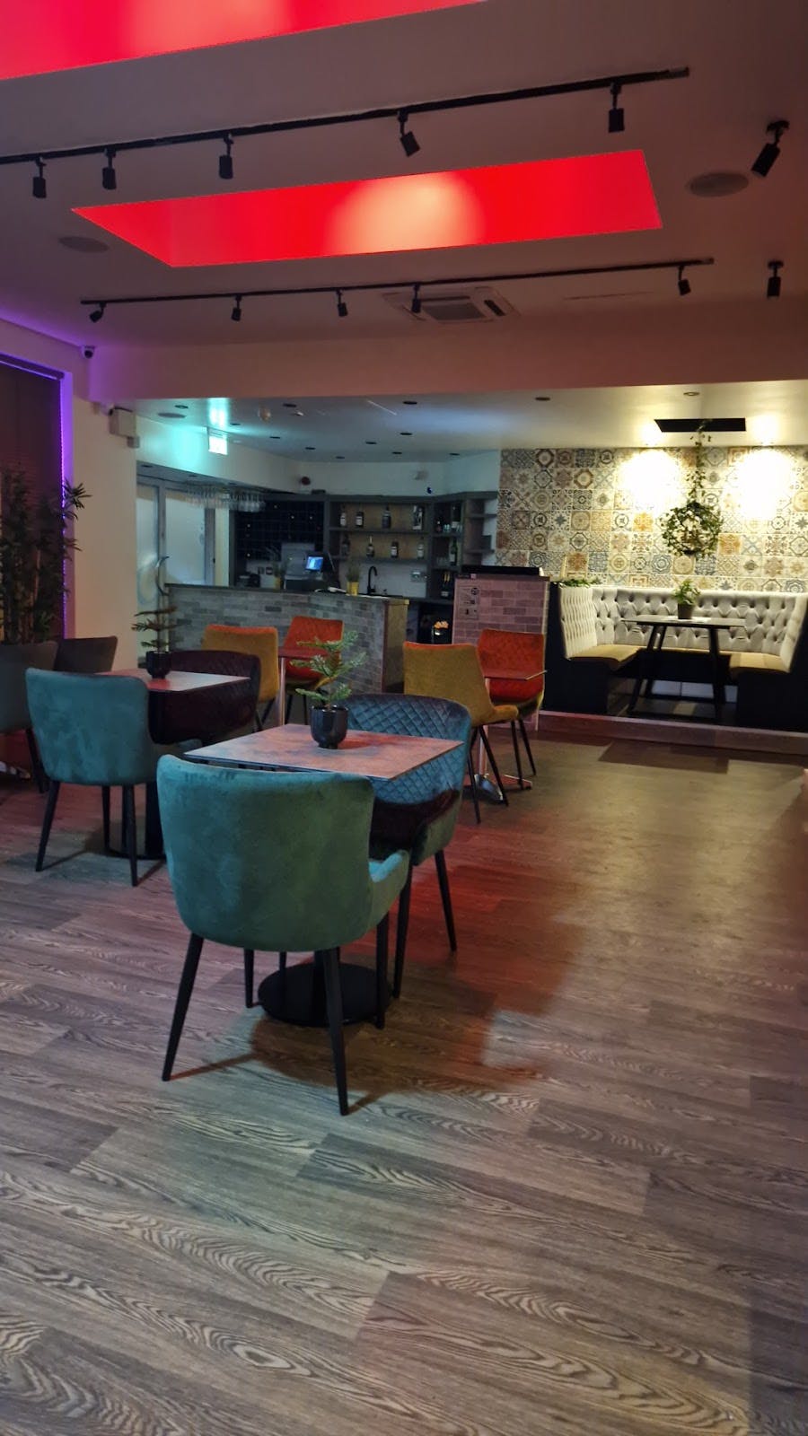 Lounge in Buka Royale with vibrant chairs, ideal for networking events and meetings.