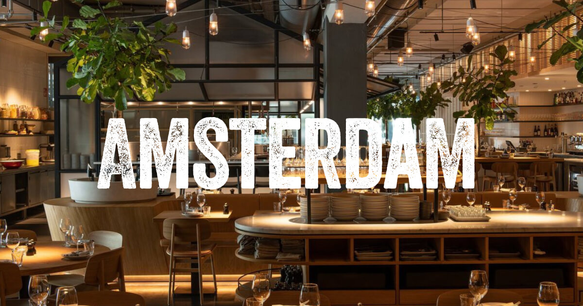 Modern cocktail bar in NENI Amsterdam, ideal for events with stylish decor and warm lighting.