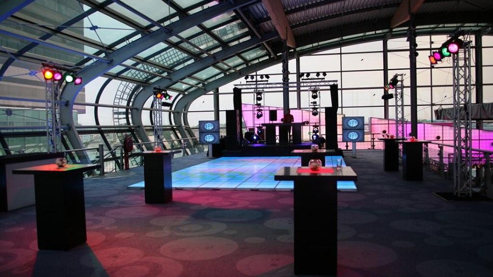 Modern event space at Passenger Terminal Amsterdam with vibrant dance floor, ideal for corporate events.