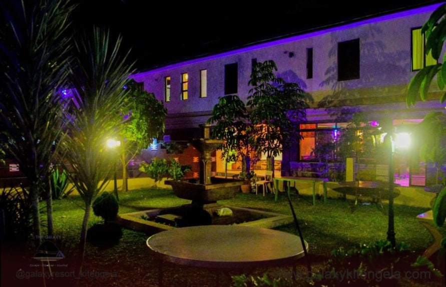 Halls at Galaxy Resort Kitengela with vibrant purple lighting for evening events.
