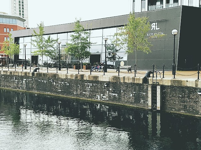 Modern waterfront venue with large glass windows for events and meetings.