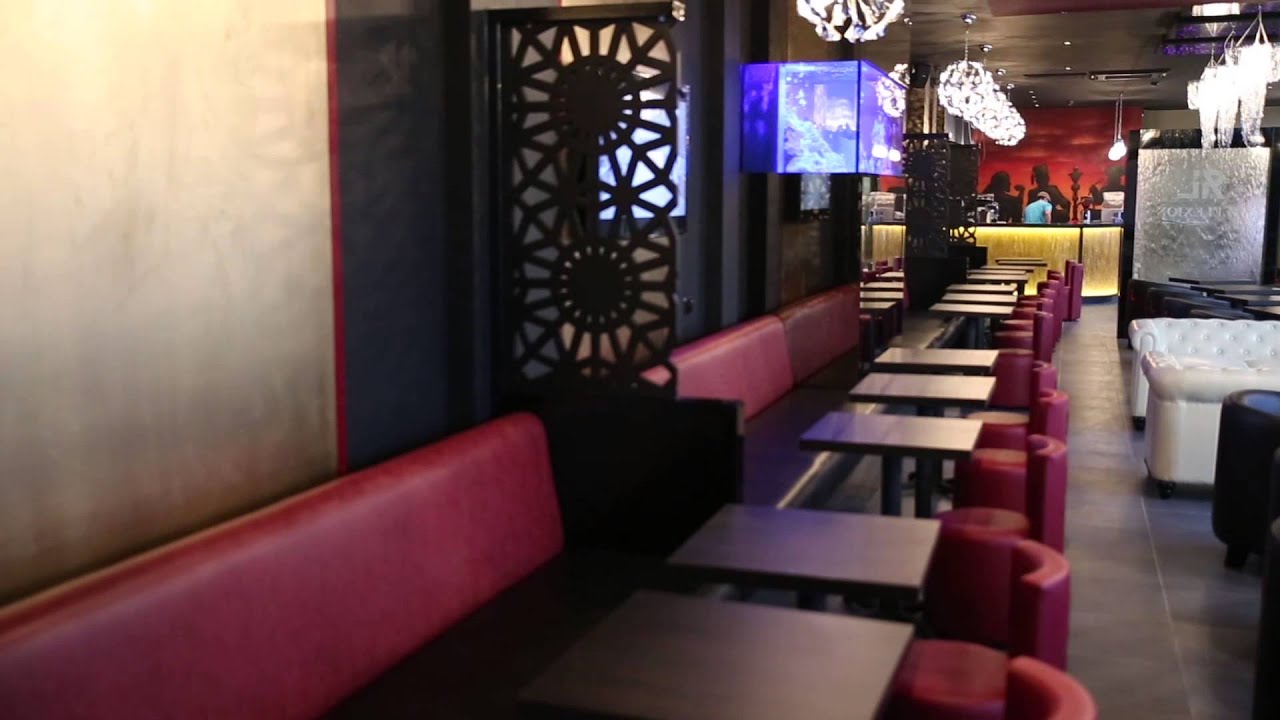 Stylish Reflexion Lounge venue with sleek tables for intimate meetings and events.