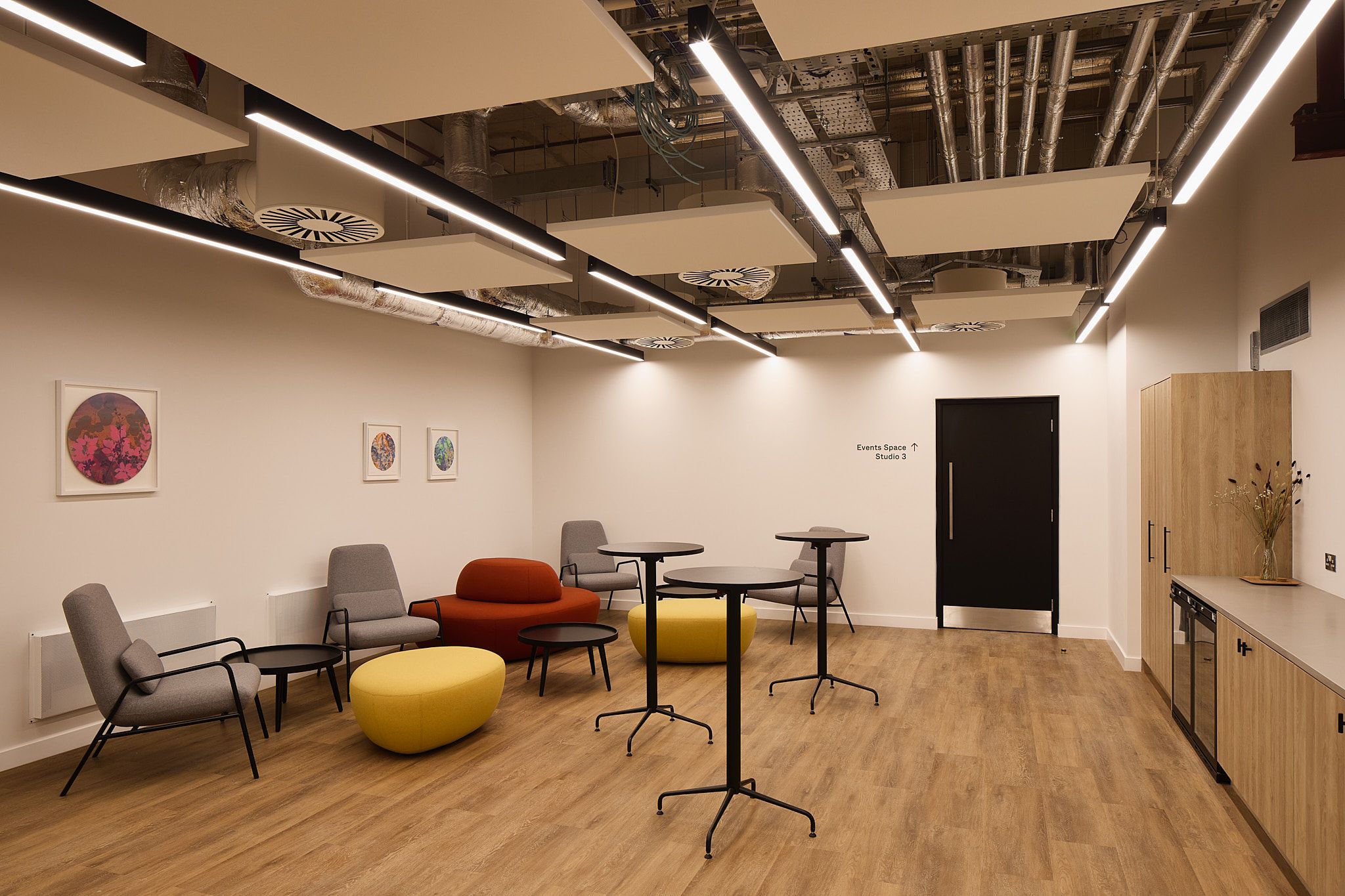 Versatile auditorium with modern furnishings for networking events at HubHub Worship Square