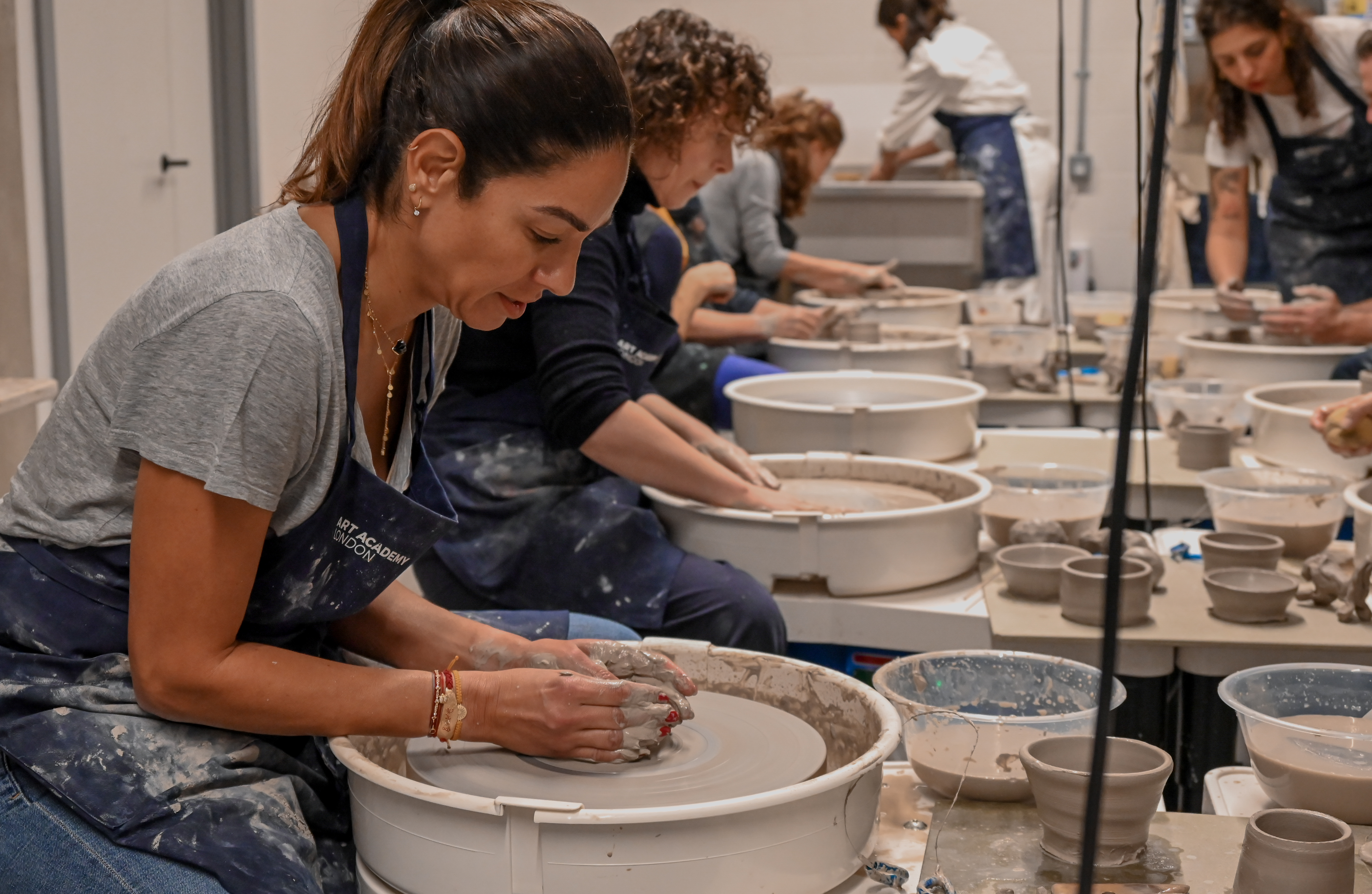 Ceramics Studio team-building event with pottery making for creativity and collaboration.