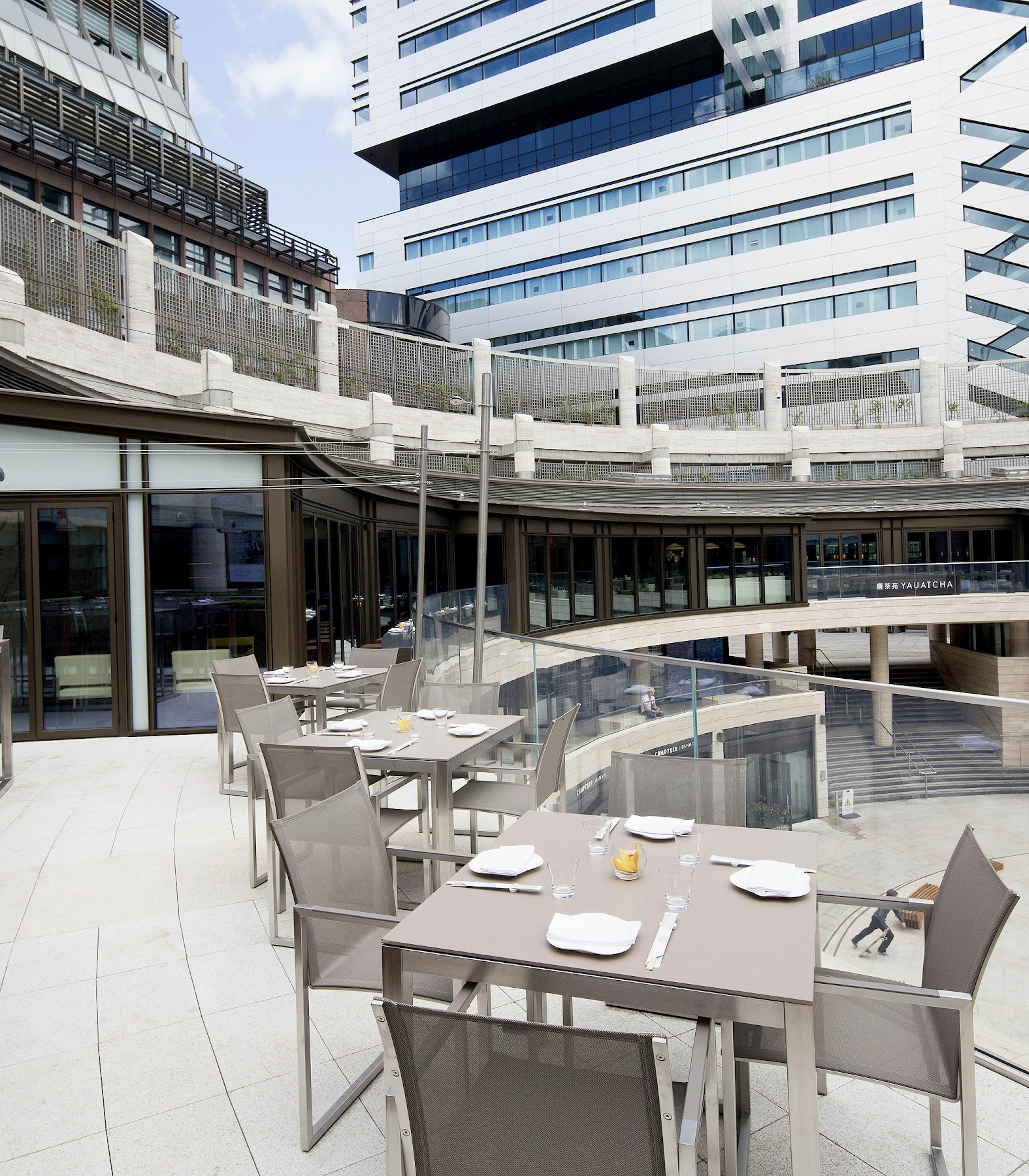 Outdoor terrace at Hakkasan with modern furniture for networking events and gatherings.