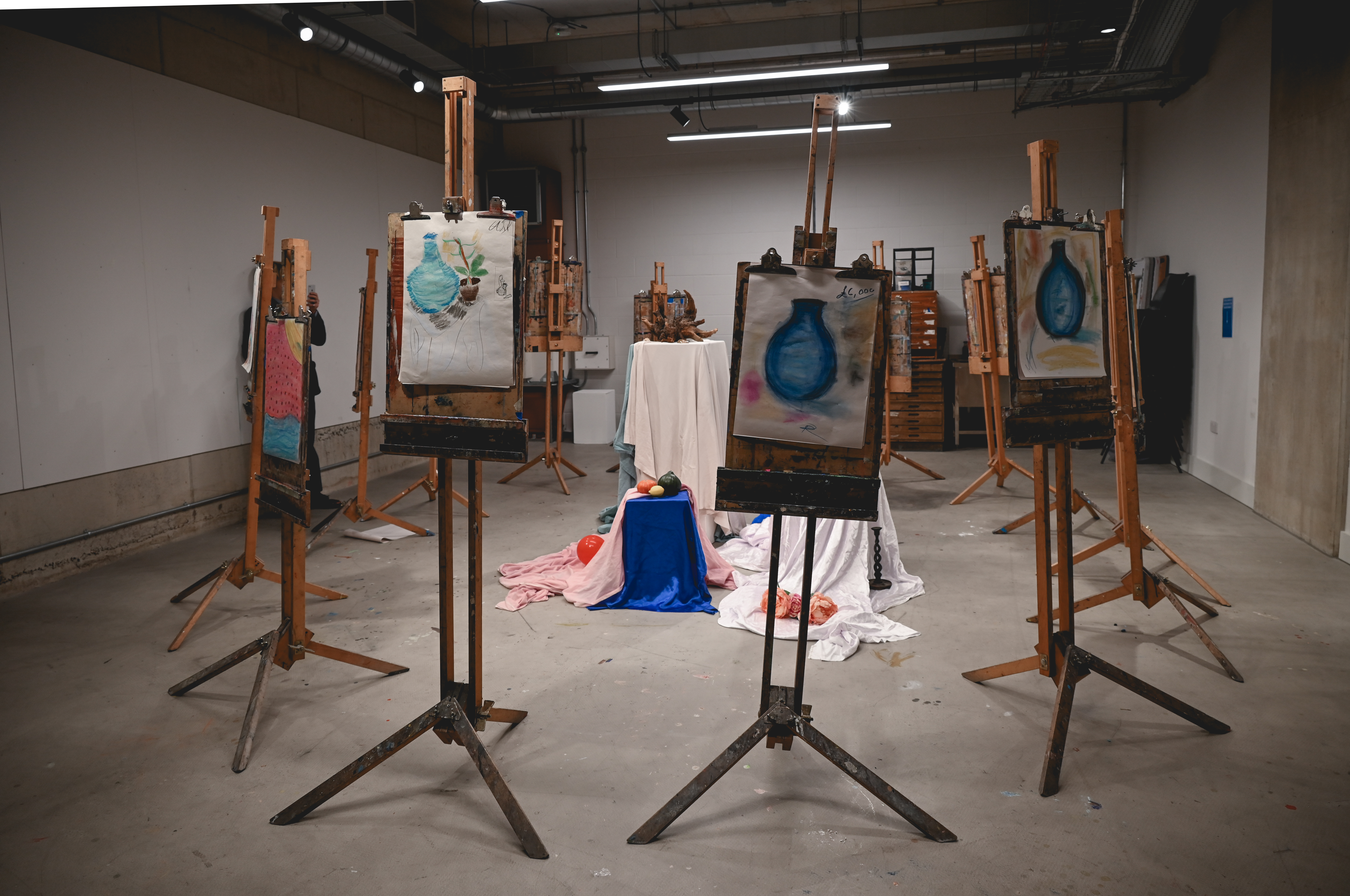 Art workshop setup in The Art Academy featuring easels and creative atmosphere.