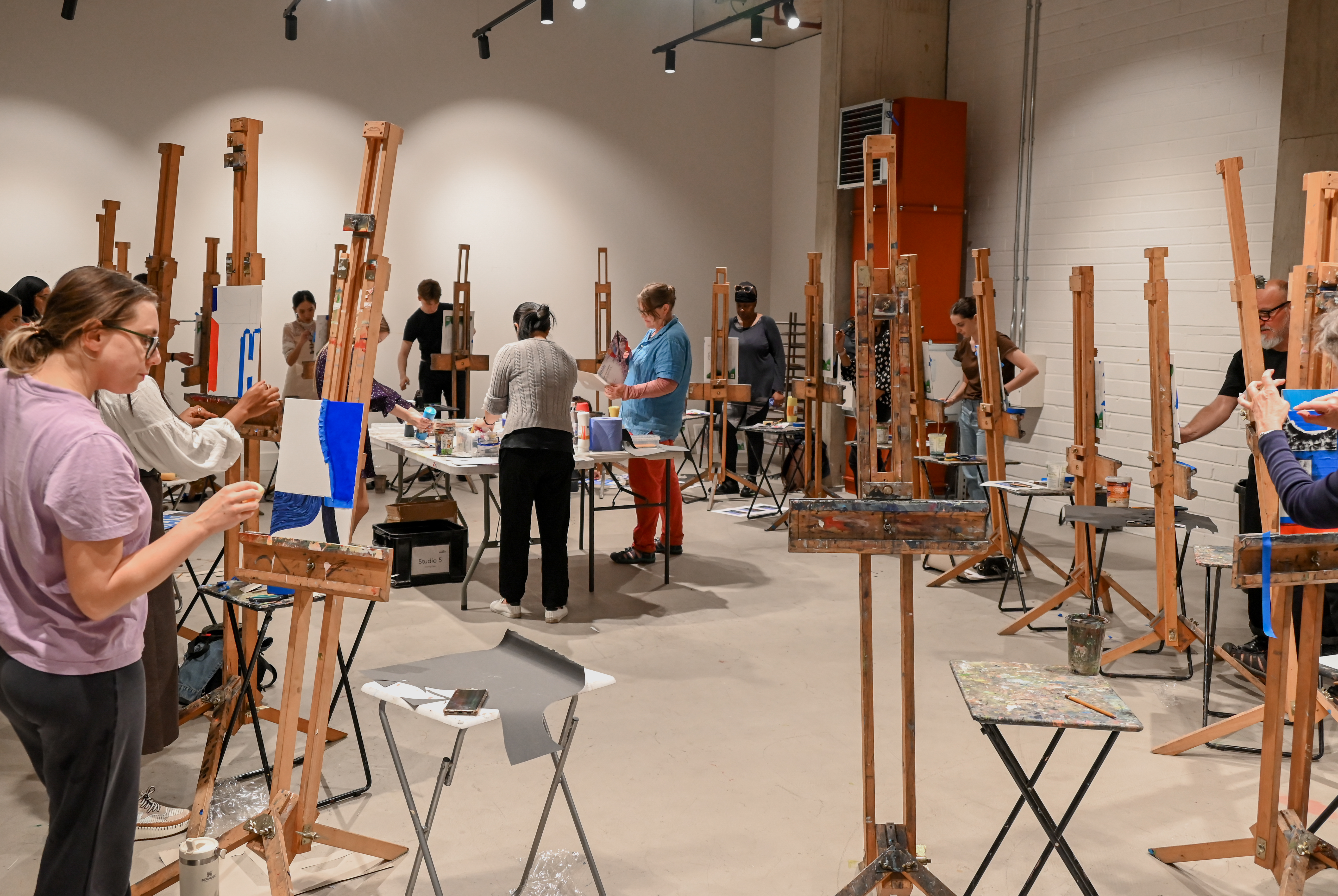 Art Academy Painting Studio with vibrant group session for creative workshops and team-building.