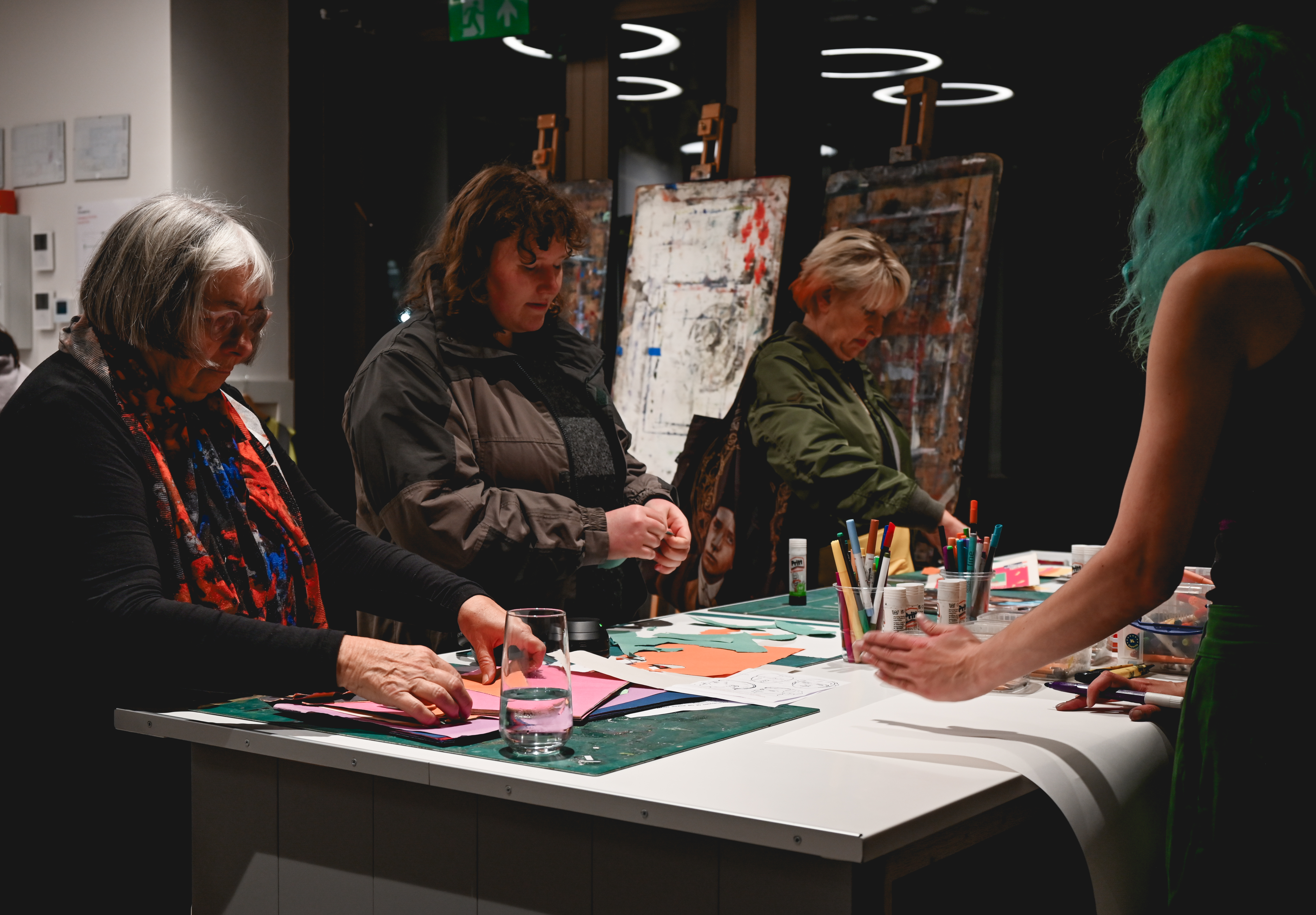 Creative workshop in art studio with vibrant materials, ideal for team-building events.