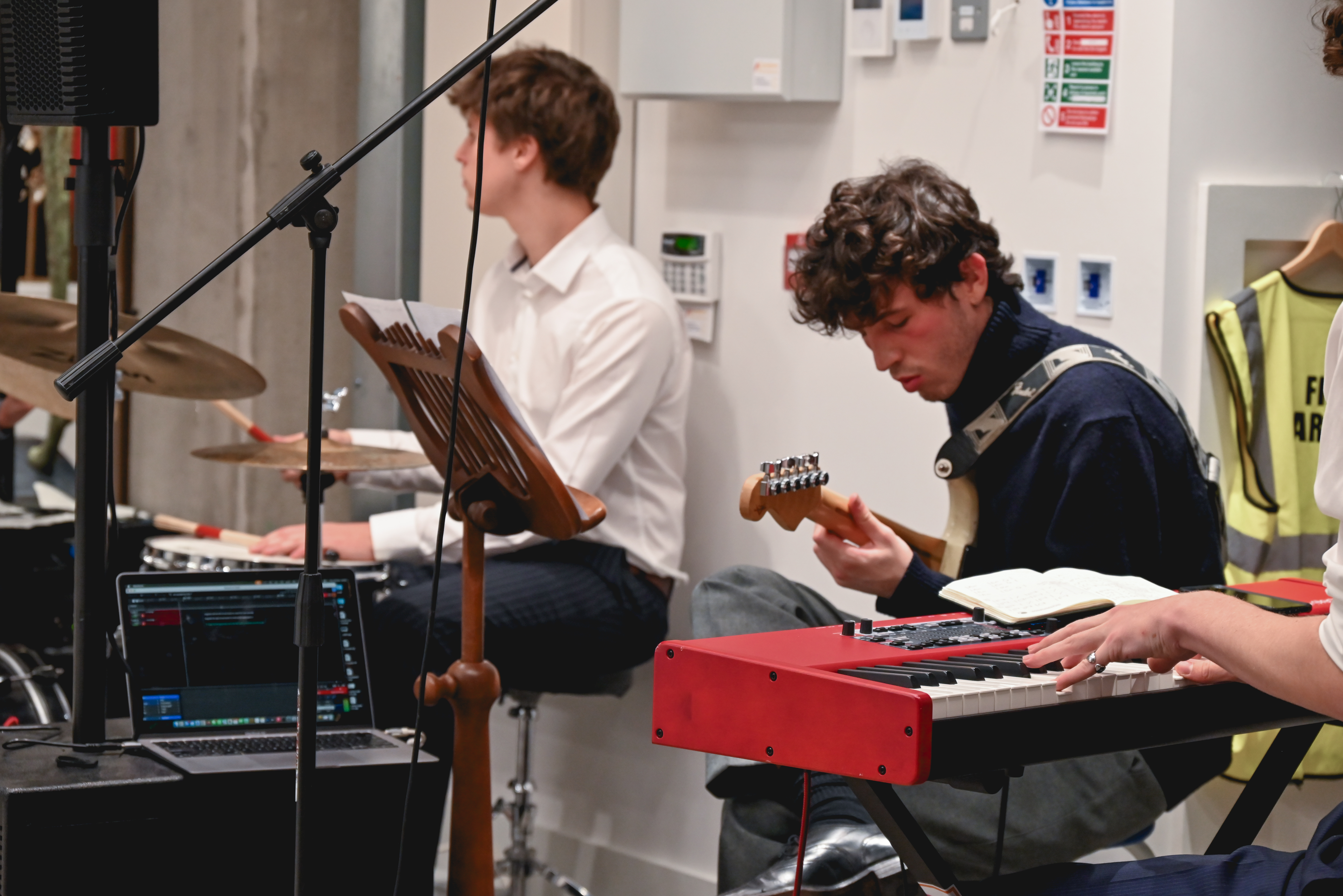 Lively live music event at The Hub, featuring musicians and dynamic acoustics.