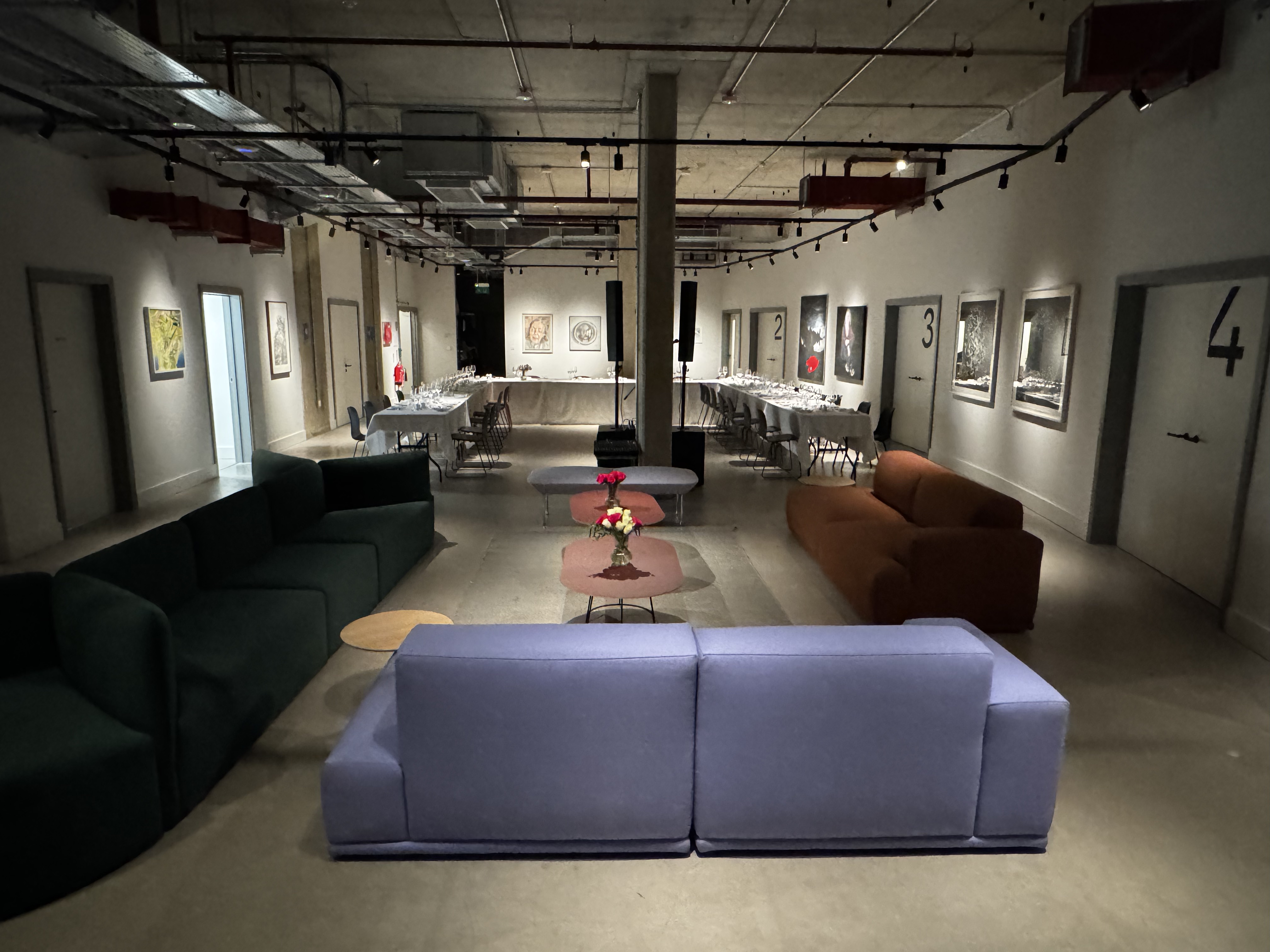 Versatile event space in The Art Academy with contemporary sofas for networking and gatherings.