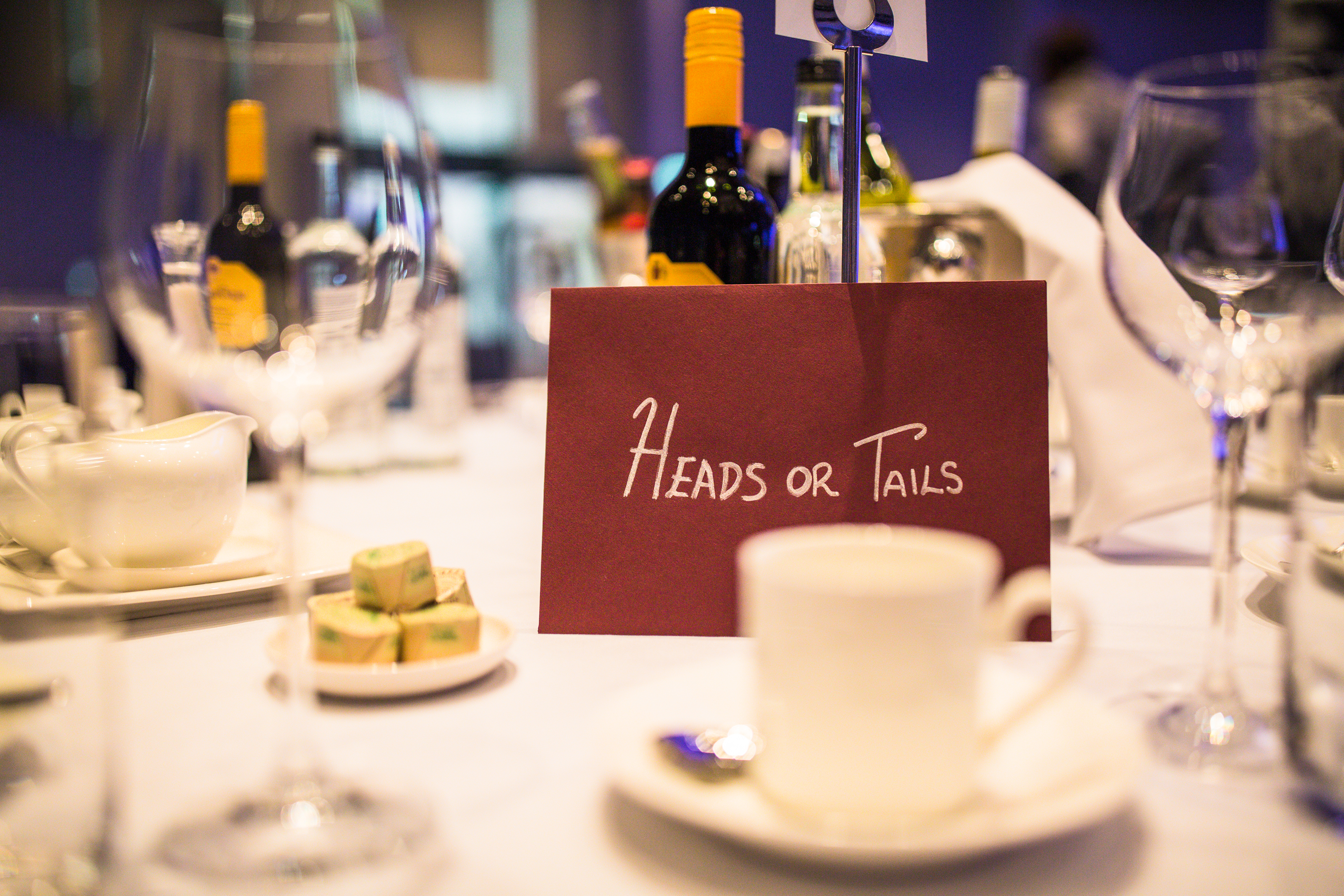 Elegant dining setup in Wembley Stadium's Great Hall for interactive event.