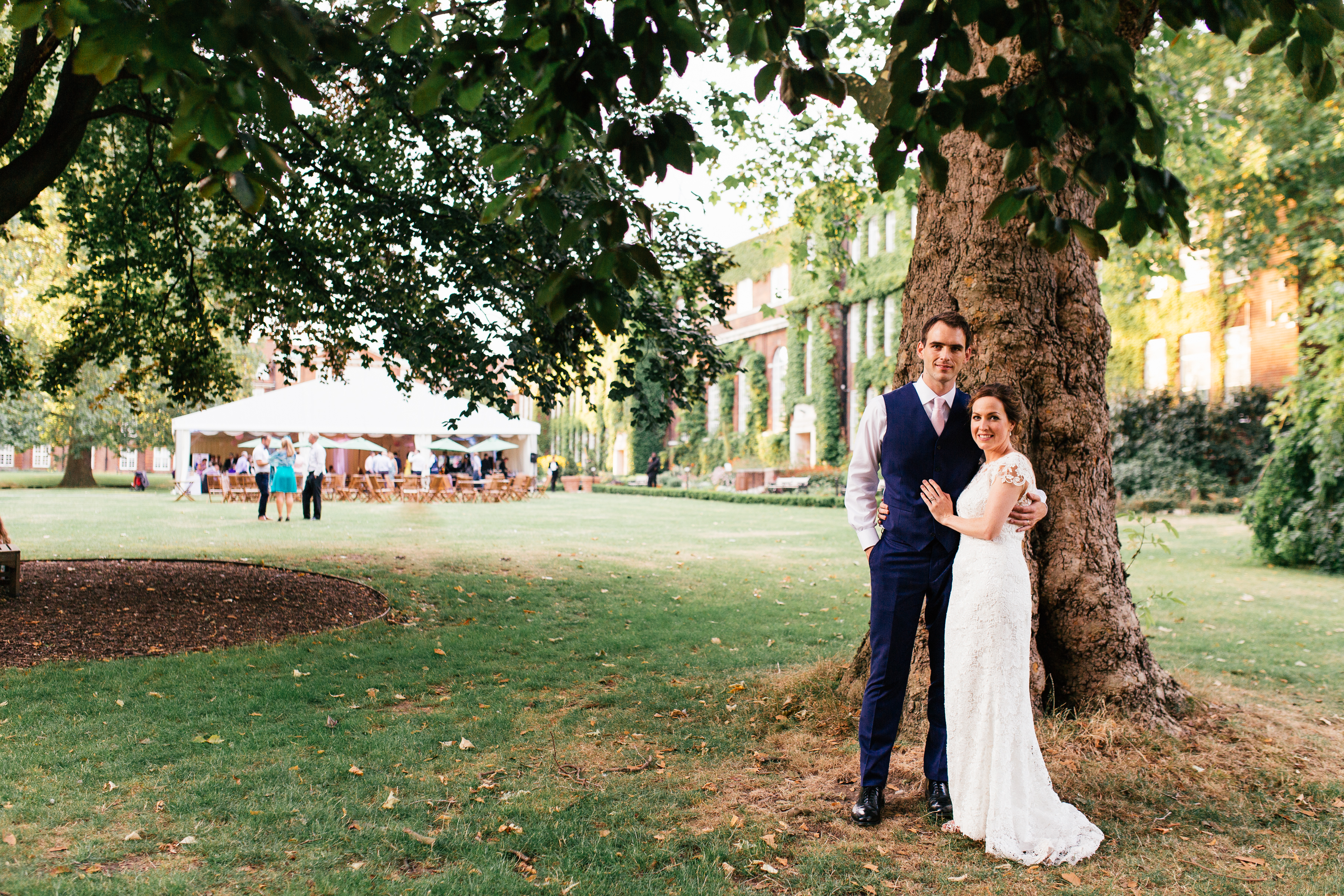 Couple in formal attire at York Lawns, a romantic wedding venue with lush greenery.