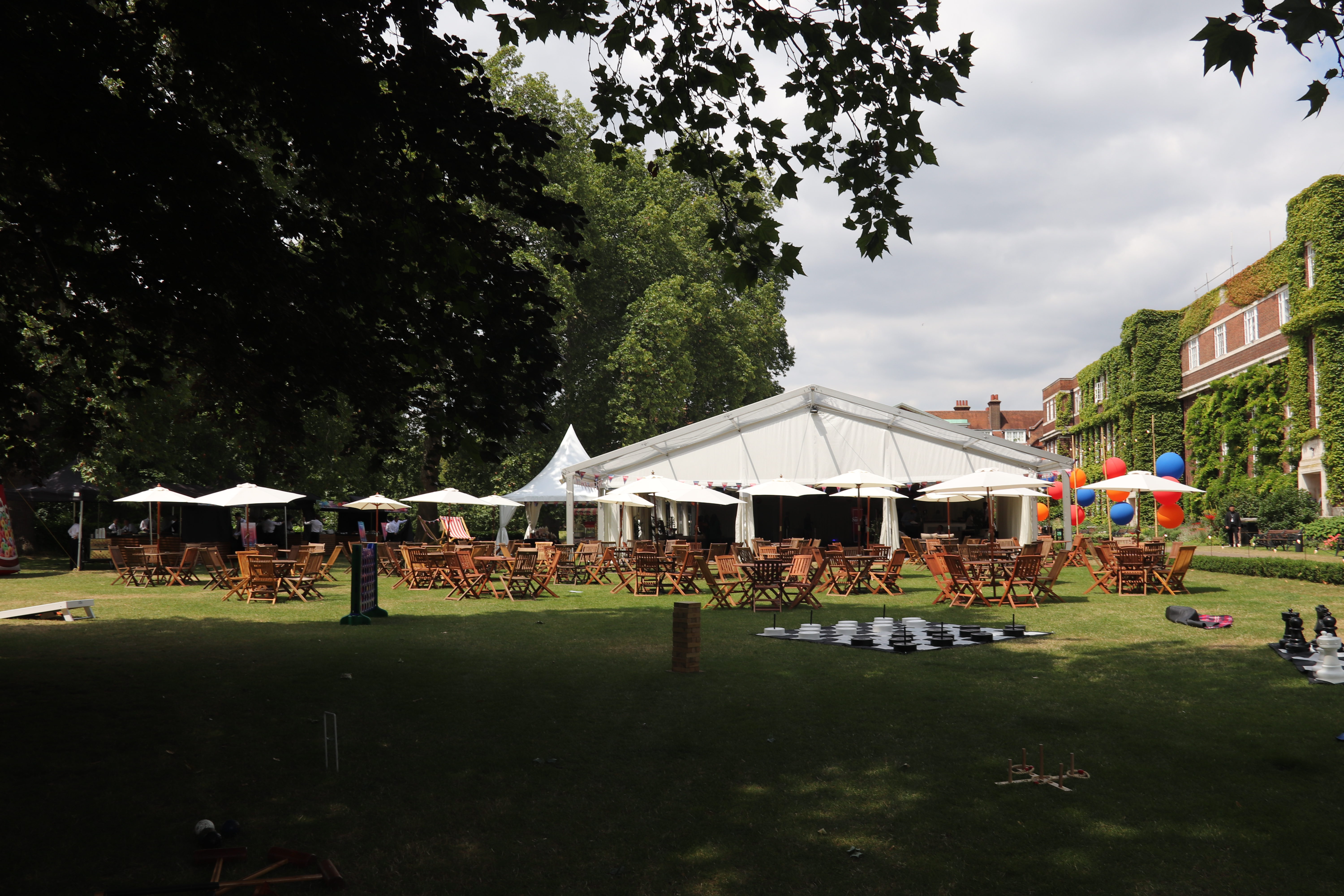 Outdoor event space at York Lawns with marquee, tables, and festive balloons.