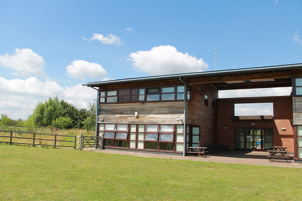 The Rectory outdoor venue with large windows, ideal for corporate retreats and events.