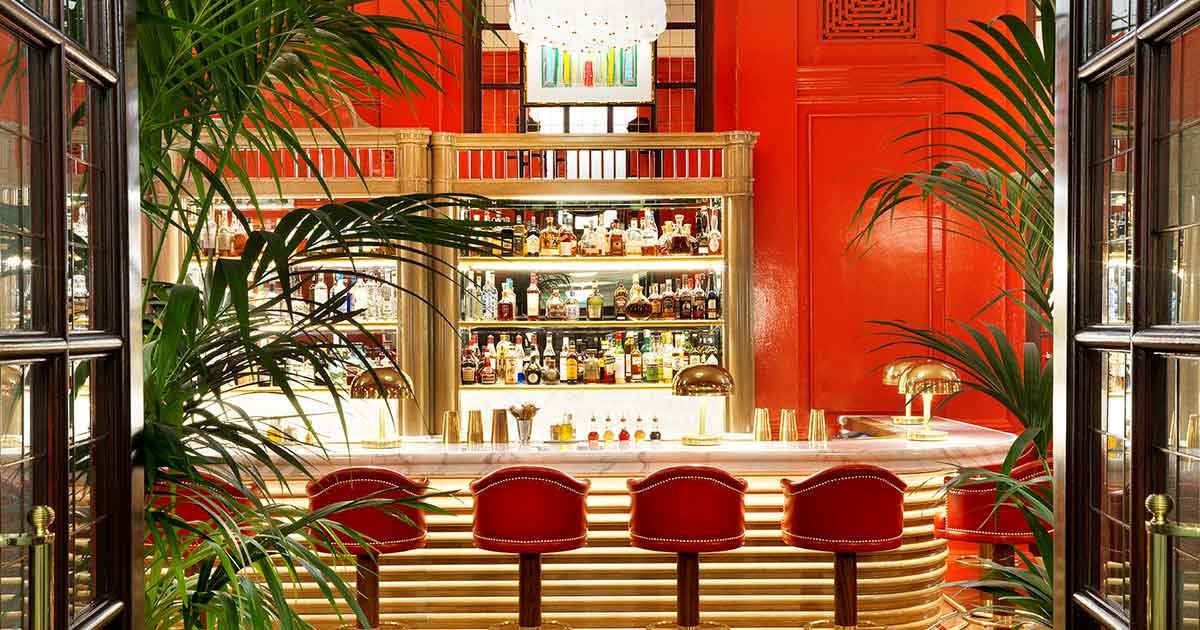 Stylish Coral Room bar with plush seating for cocktail receptions and networking events.