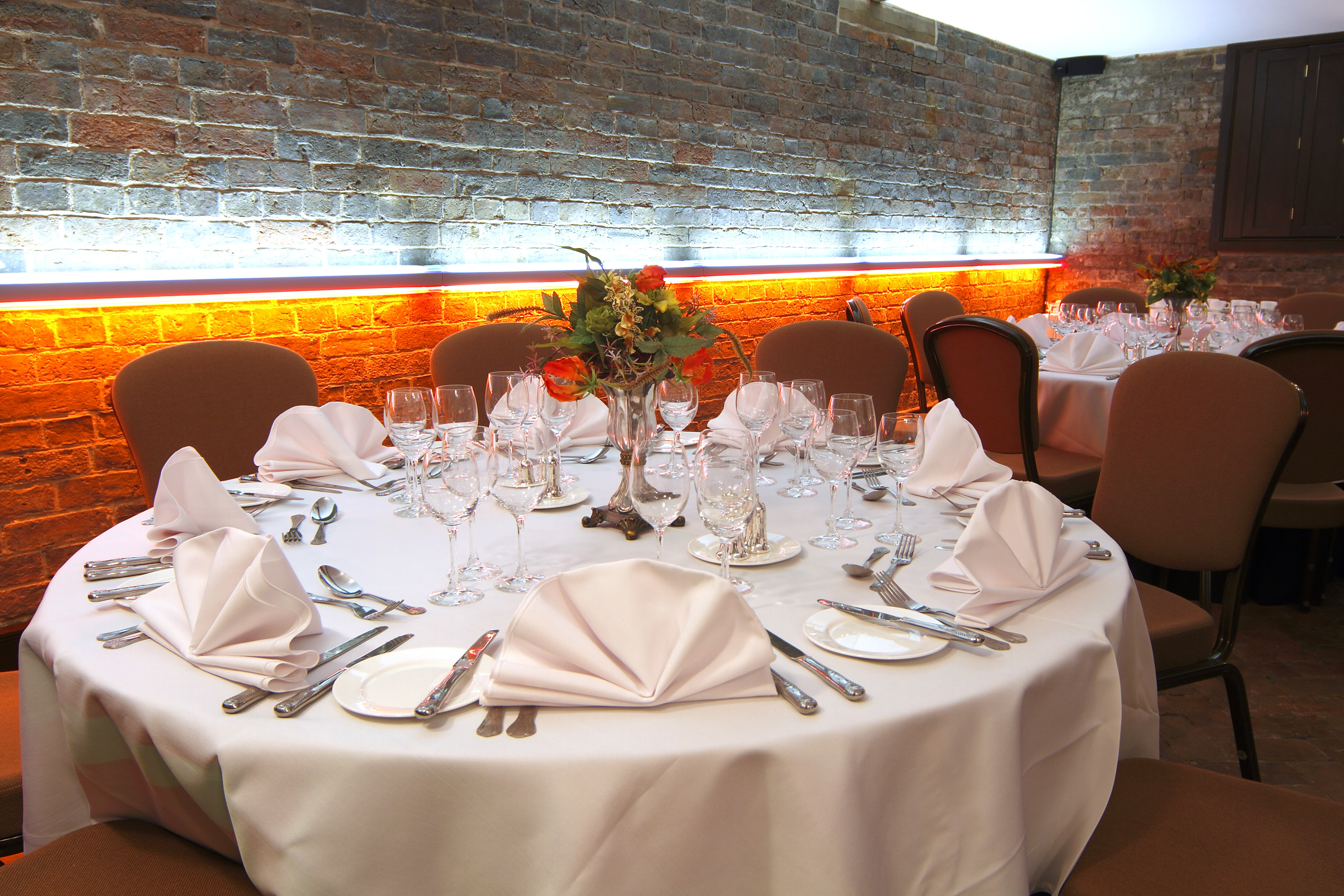 Elegant round table setup for formal dining at West Midlands Safari Park.