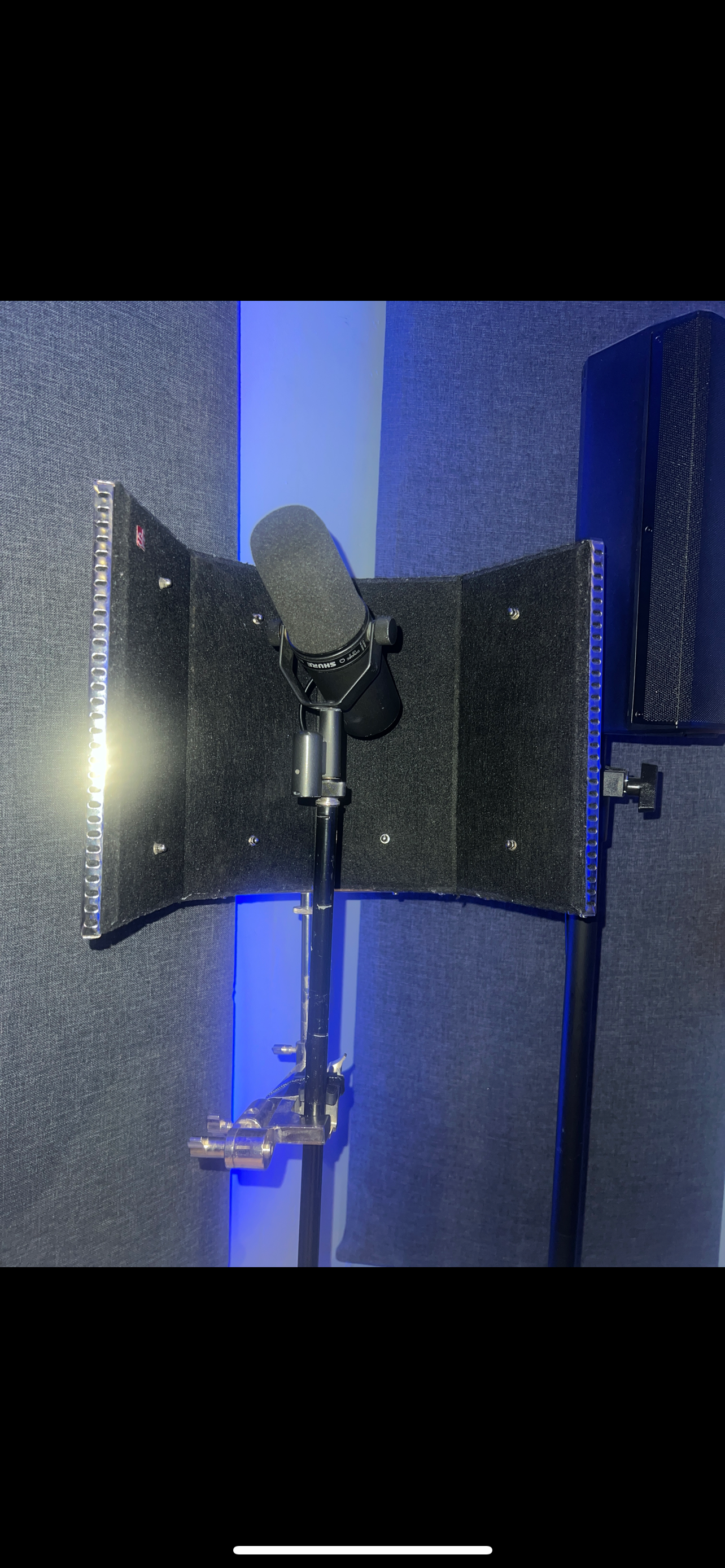 Professional microphone setup in soundproof studio for virtual events.