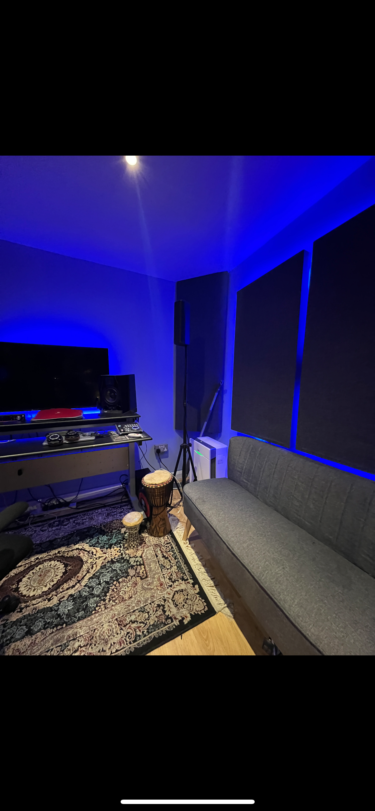 Modern meeting space at BlueHawk Studios, featuring acoustic panels for sound quality.