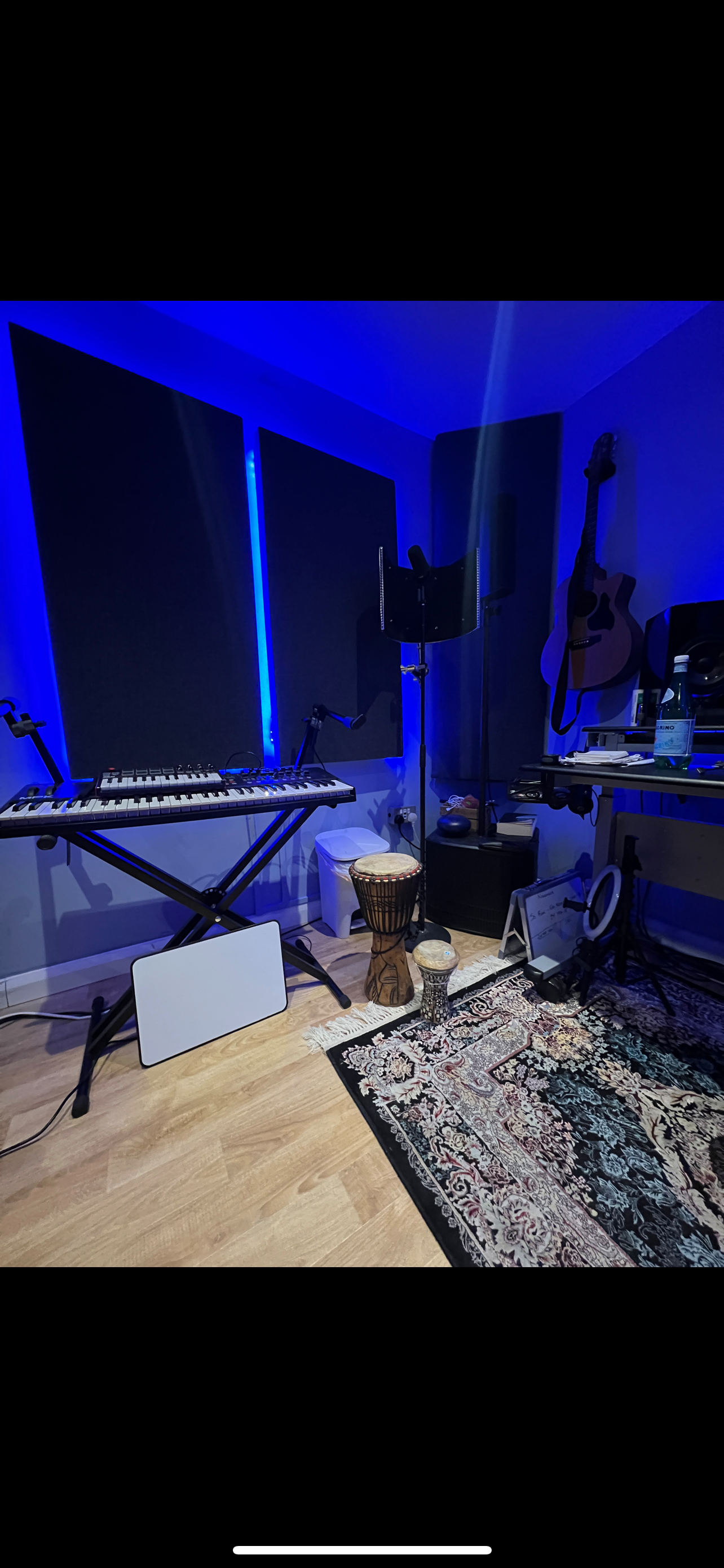 BlueHawk Studios: modern hybrid event space with blue lighting and sound equipment.