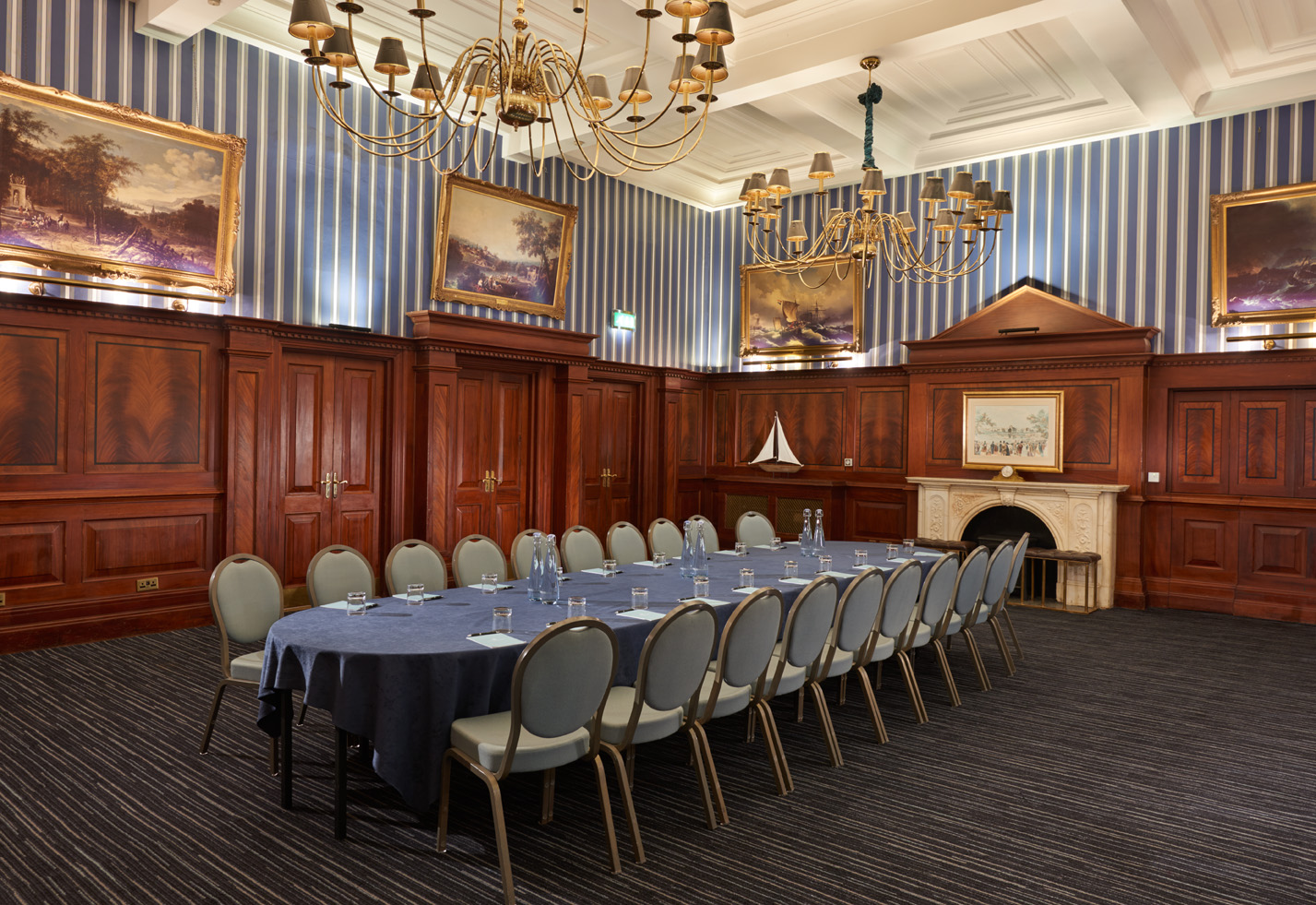 Elegant meeting room at The Regent, featuring an oval table for corporate events.