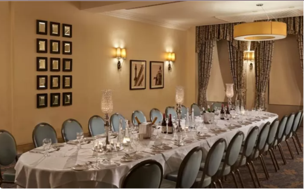 Elegant banquet setup for corporate dinner at The Grand Brighton, featuring fine linens.
