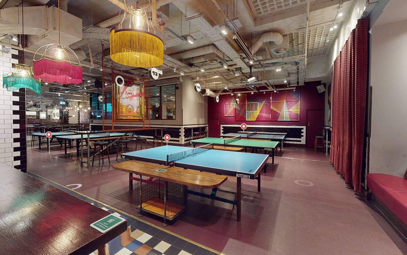 Vibrant event space with ping pong tables for team-building and networking in Farringdon.