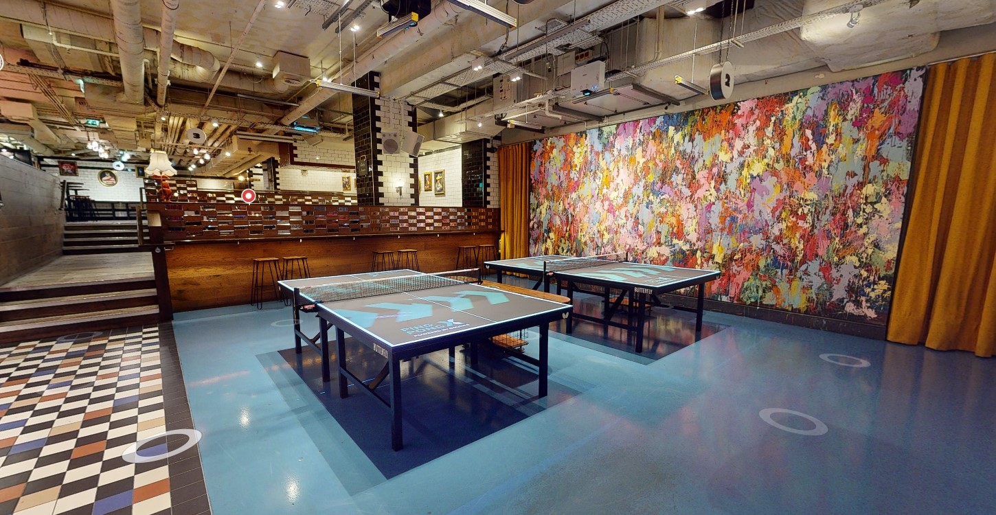 Vibrant event space with ping pong tables at The Olympia, ideal for networking and team-building.