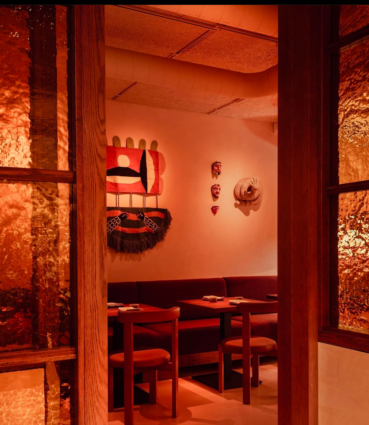 Vibrant Sala Rosa restaurant with warm lighting, ideal for intimate gatherings and events.