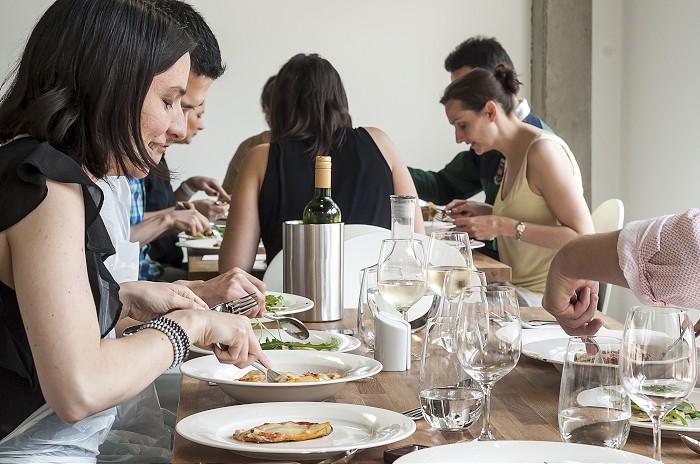 Corporate event dining setup at Jenius Social with elegant glassware for networking.
