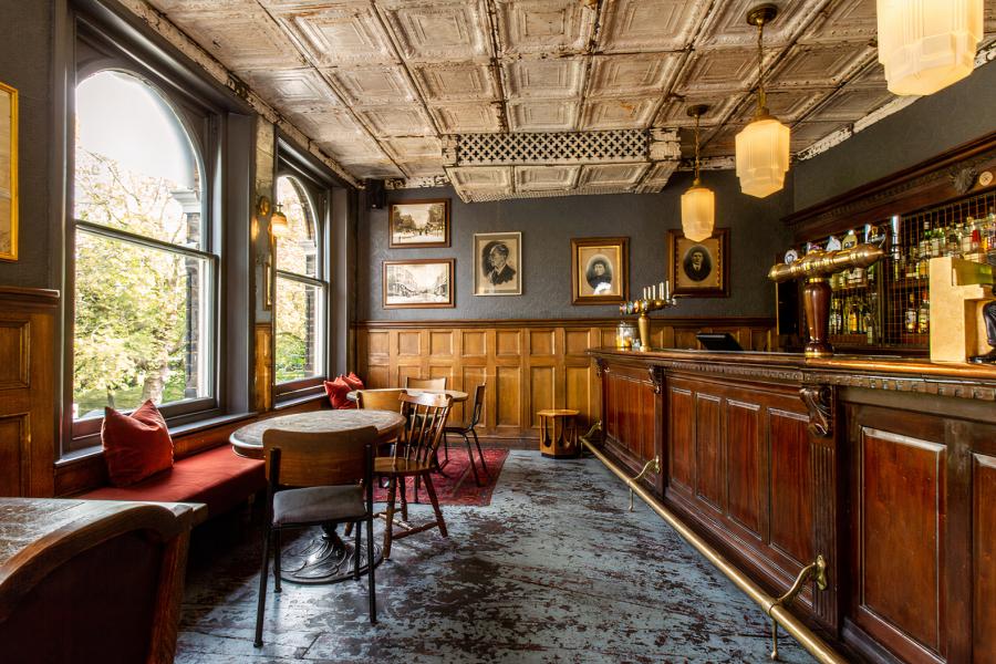 Greenhouse Taproom: inviting venue with wood accents for intimate gatherings or events.