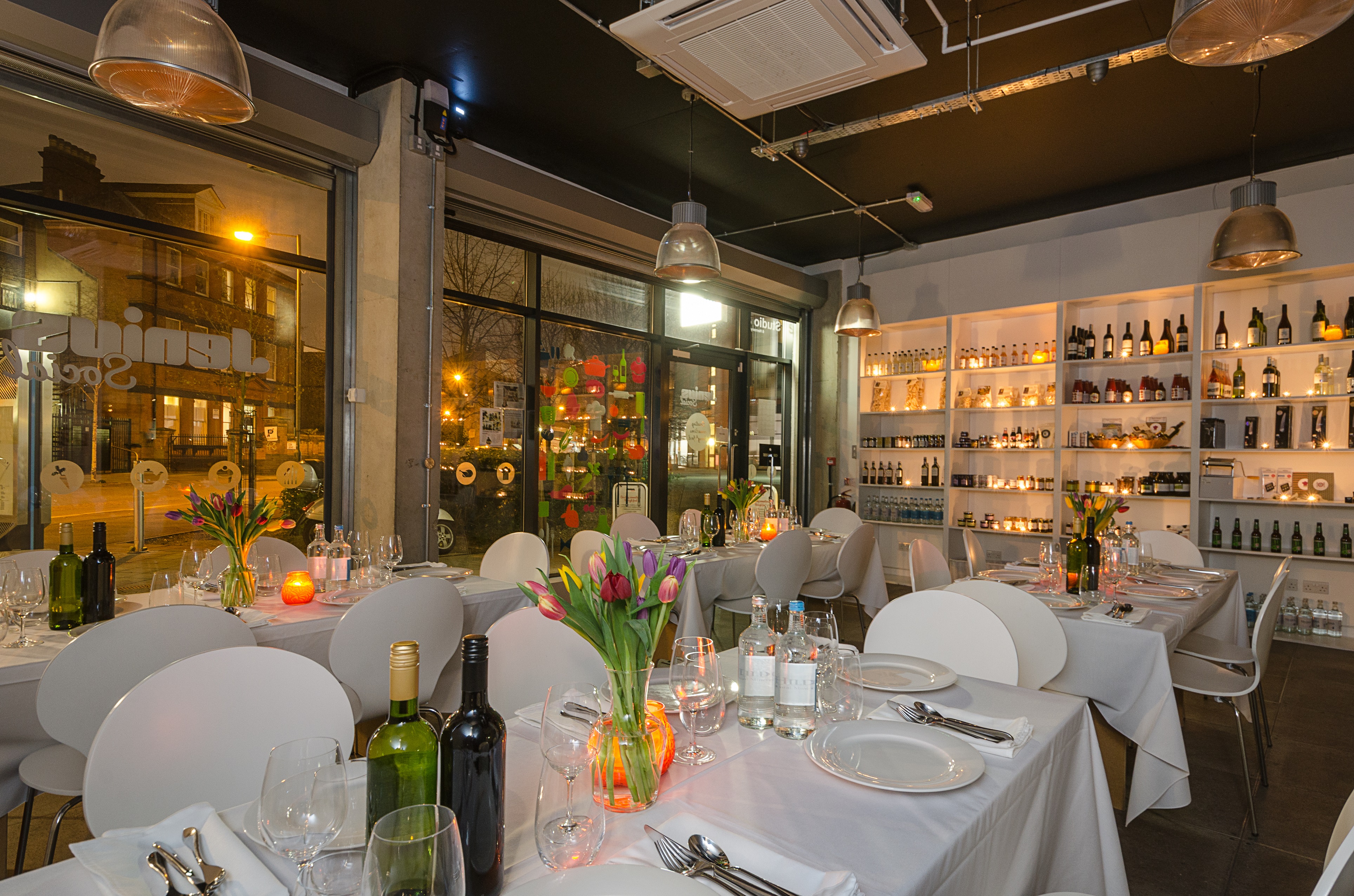 Stylish dining space at Jenius Social, perfect for intimate events with elegant table settings.
