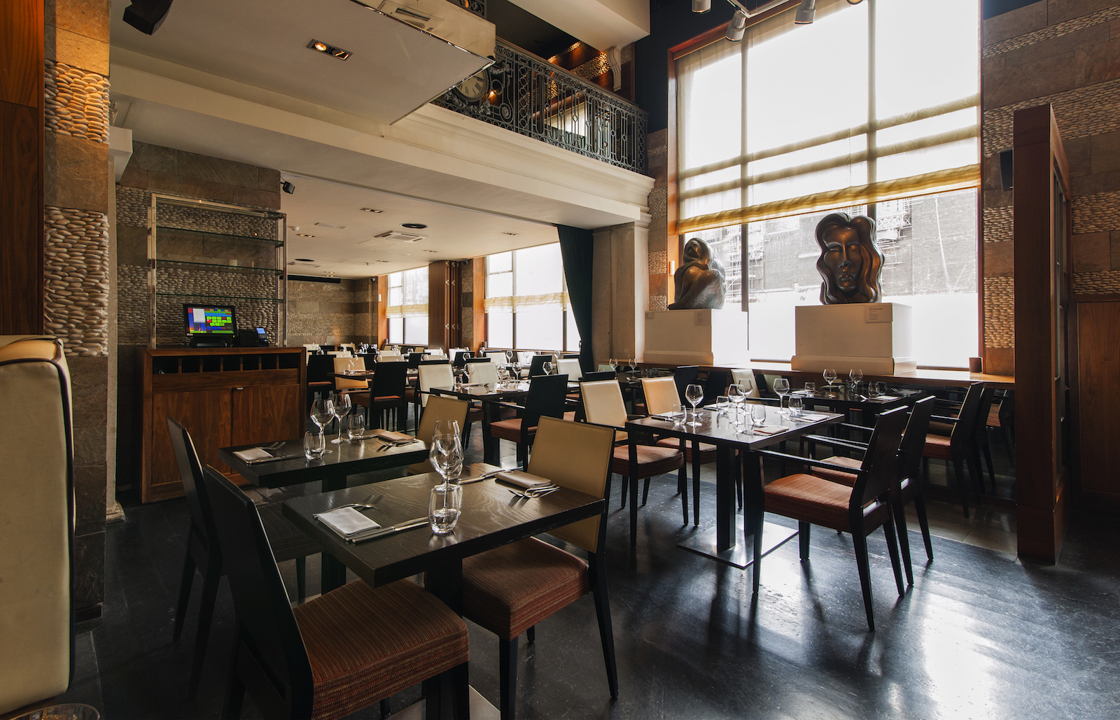 Modern restaurant venue with elegant decor for intimate meetings and small events.