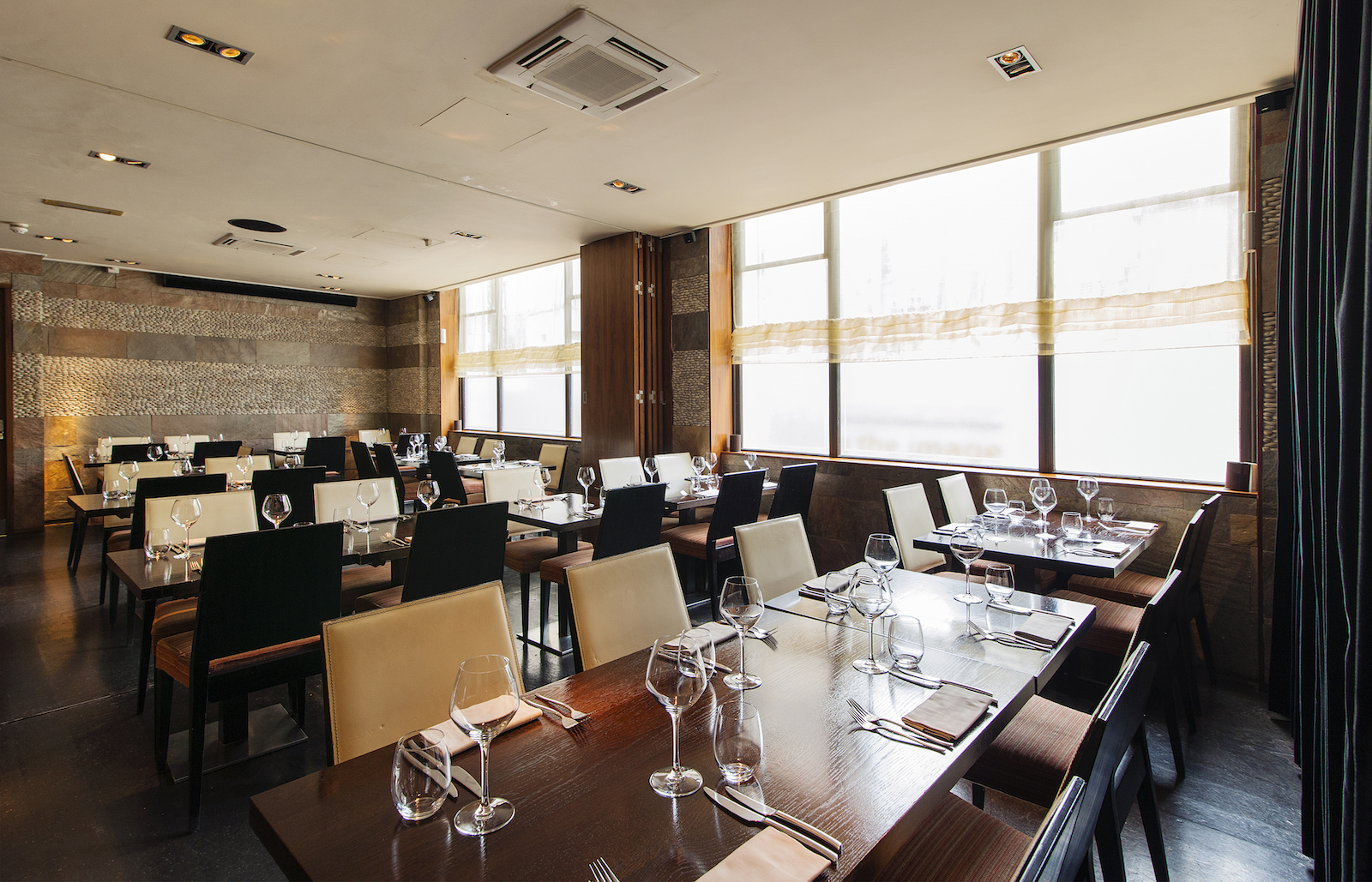 Whole Venue at Mint Leaf Lounge with elegant tables, perfect for corporate events and meetings.