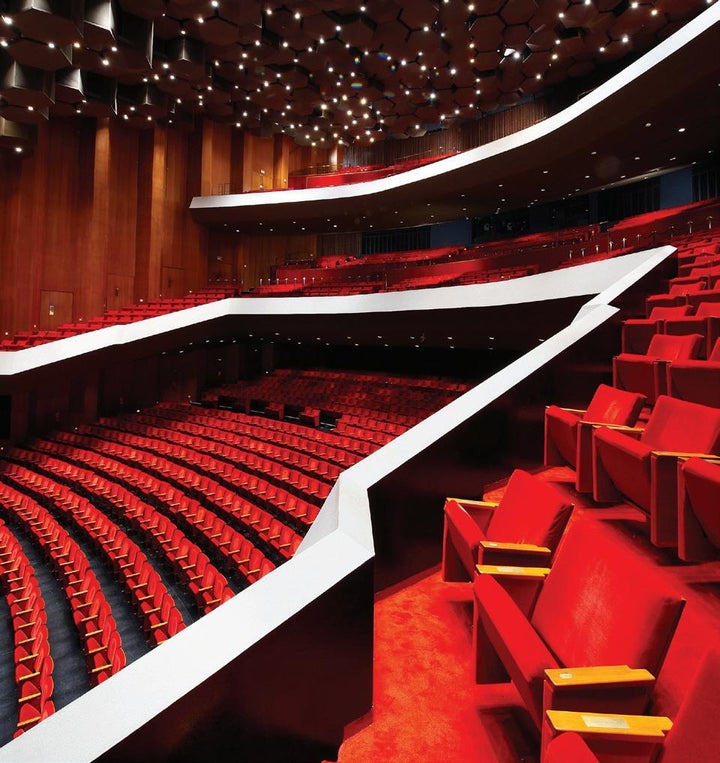 Stage in Jones Hall: tiered seating, vibrant red seats for conferences and performances.
