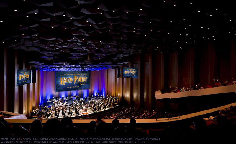 Stage in Jones Hall set for a Harry Potter concert with tiered seating and immersive branding.