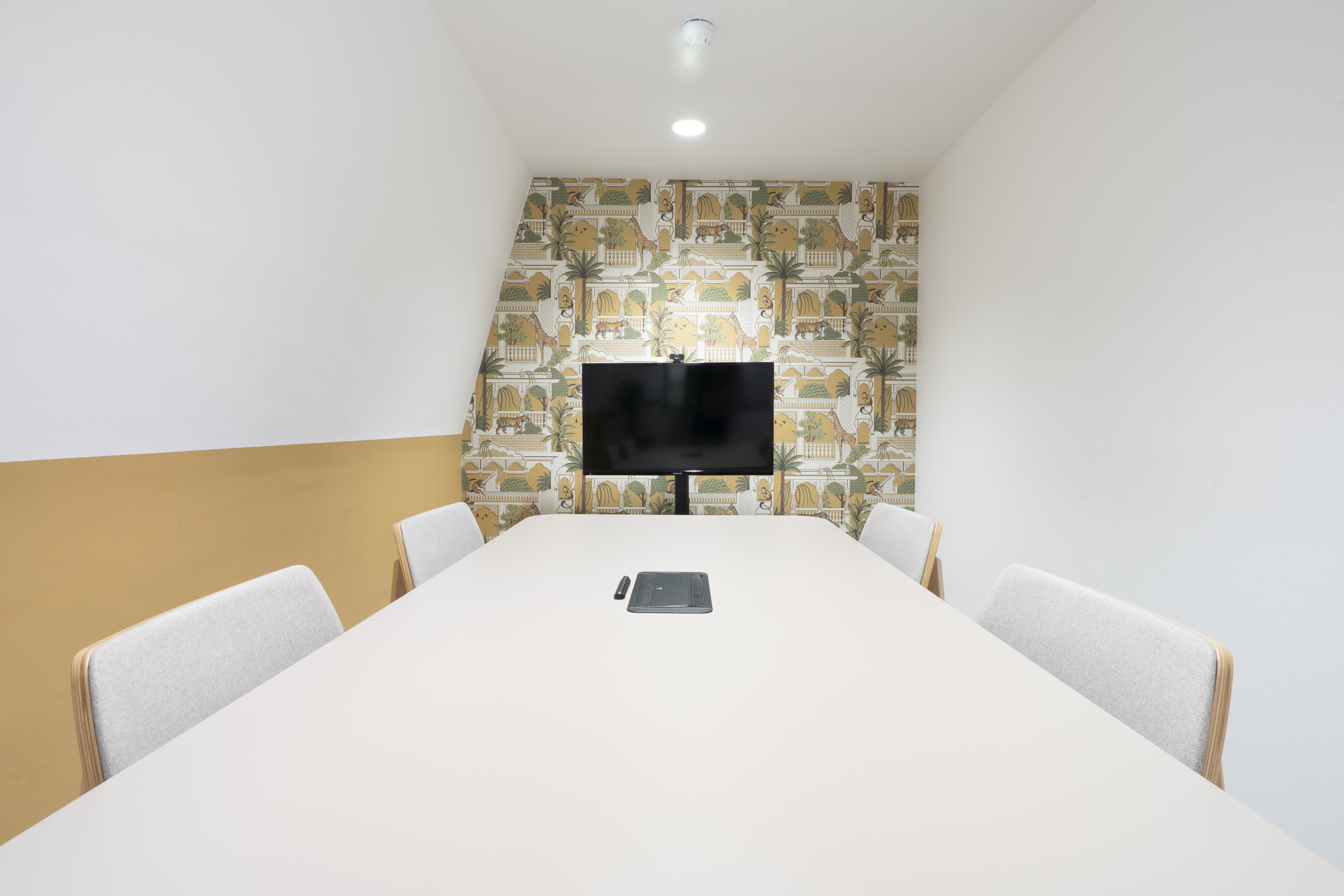 Modern meeting room at Runway East Borough Market, featuring a sleek table and cozy seating.